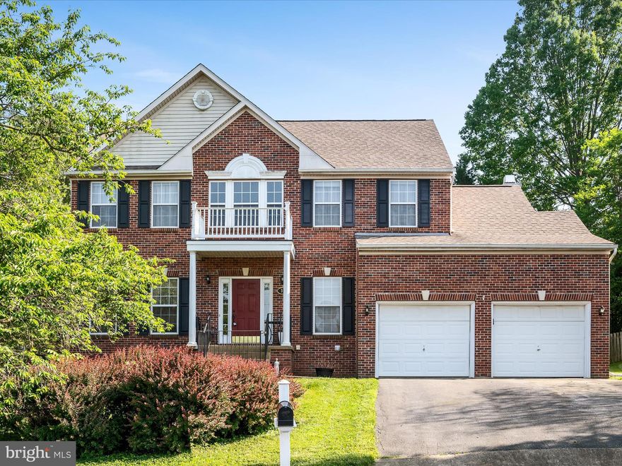 *NEW PRICE - INSTANT EQUITY* Gorgeous brick-front residence on a cul-de-sac lot with fenced yard and fully finished lower level! Featuring almost 4,000 finished square feet, sprawl out in this 4-bedroom/3.5 bath home situated in the popular golf community of Locust Hill. This location is ideal for commuters seeking easy access to Virginia and Maryland who also desire living in a relaxed setting just minutes from local towns, farm markets, shopping, and major thoroughfares. A freshly painted two-story foyer invites you in to the spacious floor plan featuring an open-concept kitching/family/morning room combo plus a separate formal dining and living room - all with grand 9' ceilings. Plenty of space is available in the 4 bedrooms upstairs, including the spacious primary suite with vaulted ceilings, in addition to the finished lower level that has another full bath. The back deck is the perfect place to unwind, while the fully fenced yard affords conveniences for pet owners, families, and gardening gurus alike. Priced well below market value, get a great deal on this home that's ready for your finishing touches!