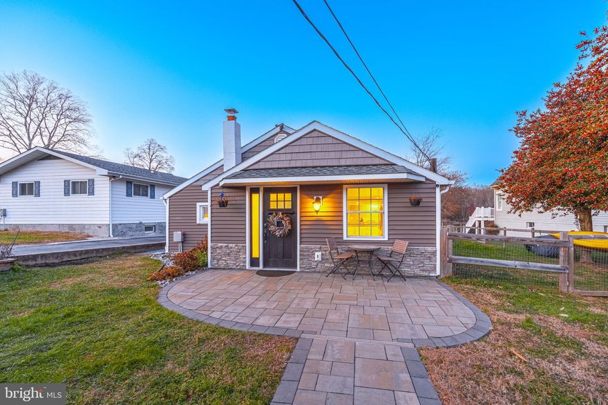 Treat yourself to this beautiful waterfront home with no flood insurance needed in a serene location along the picturesque banks of Sue Creek. Enjoy the peaceful sounds of nature while being just moments away from the vibrant community life. Park on the 45x30 6-car paved driveway. Take a walk into an open floor plan where everything is updated. Kitchen cabinets, granite countertops, stainless steel appliances, and a breakfast nook addition. Walk through the living room and enter into the 4 seasons addition with an electric fireplace installed in stone with a mantel and bar area. Embrace the beauty of the outdoors with scenic views of the Sue creek and woods on your beautifully landscaped pavers. Basement has been waterproofed fully finished with full bathroom that has a walk-in shower. A bookshelf door hides the separate laundry room, the barn door leads to a walk-in closet, or office. Exit to the waterfront and check out the 70' pier, 10K lb. boat lift and 2 jet ski lifts. Need storage outside, no problem with a 12x20 garage and 8x12 shed you will have plenty. This home is move in ready. Recent roof, windows, siding and 2 -amp electrical service upgrade. Don't miss this opportunity to own a piece of paradise. Envision yourself in this home, schedule your showing today!! Note the square footage on tax record does not include the additions.