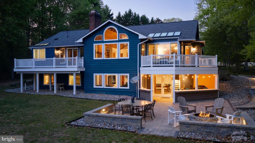 Lake Anna living feels effortless in this park-waterfront retreat which gives you waterfront benefits without the steep waterfront price! With this type of lot, you have direct access to the water through the adjacent waterfront common area. Walk directly from your house to the water's edge! This retreat sits on 1.26 acres with peaceful water views creating a setting that’s equal parts relaxing and ready for fun. The outdoor spaces do most of the convincing—a spacious deck and an expansive paver-stone patio with a stone fire pit, bar area, and plenty of room for gathering make it easy to linger a little longevity than planned.  Inside, 3,766 square feet blends classic Craftsman character with comfortable functionality. The main-level great room features vaulted tongue-and-groove ceilings, a red brick fireplace, built-ins, and floor-to-ceiling windows that keep the lake in constant view. The kitchen offers an island with bar seating and flows naturally for entertaining, while the main-level primary suite includes private deck access. A second bedroom and full bath complete the main level, providing flexibility for guests or everyday living. The finished lower level adds even more room to spread out, complete with a spacious recreation area, a well-appointed wet bar, a wood stove with brick fireback, and two additional bedrooms.  Large detached garage perfect for boat, jet ski and vehicle storage!  Offered partially furnished and meticulously maintained, this home is well-suited as a full-time residence, weekend escape, or short-term rental opportunity—with high-speed fiber internet to keep everything running smoothly when real life calls. Wyndemere offers three marinas with access to boat slips that are available for lease, boat launches, docks, and an abundance of amenities including basketball, tennis, and pickleball courts, plus picnic areas—perfect for enjoying the ultimate lake lifestyle. Enjoy a prime location just minutes from local favorites like The Cove, Tim’s at Lake Anna, Callie Opie’s Orchard Restaurant, and Lake Anna Taphouse, as well as groceries, shops, and everyday essentials. Conveniently located approximately 45 minutes to Richmond, Charlottesville, and Fredericksburg, and just 90 miles from Washington, D.C.