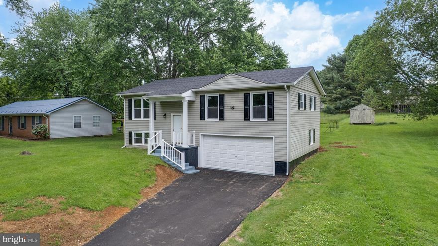 Nestled on a generous half-acre lot in historic Shepherdstown, this Split foyer home is a must see within Mecklenburg Heights where there's no HOA, only a road Maintenace Agreement. "Move-in-Ready" and updated inside and out this property works for any type of financing. Inside there are 3 bedrooms, 2 full bathrooms, finished basement and two car garage.  Boasting many upgrades like the new roof and gutters, new electric HVAC system (Central Air), new flooring, new cabinets and countertops, new appliances and fixtures, new vanities and toilets, new deck and sliding glass door. The finished basement with full bath provides additional living space that's perfect for a fourth bedroom or a home office and gym. Attached front-entry garage with electric opener and freshly paved driveway are also excellent features that complete this full package. Comes with a washer and Dryer. Don't miss the opportunity to make this affordable Shepherdstown home your own. Just outside of downtown Shepherdstown and the Shepherd University campus area, close to amenities, the Wellness Center, Food Lion, shops and eateries. New main water line from street to home. Motivated seller, will provide Home Warranty for new buyer.  Call for your tour today.