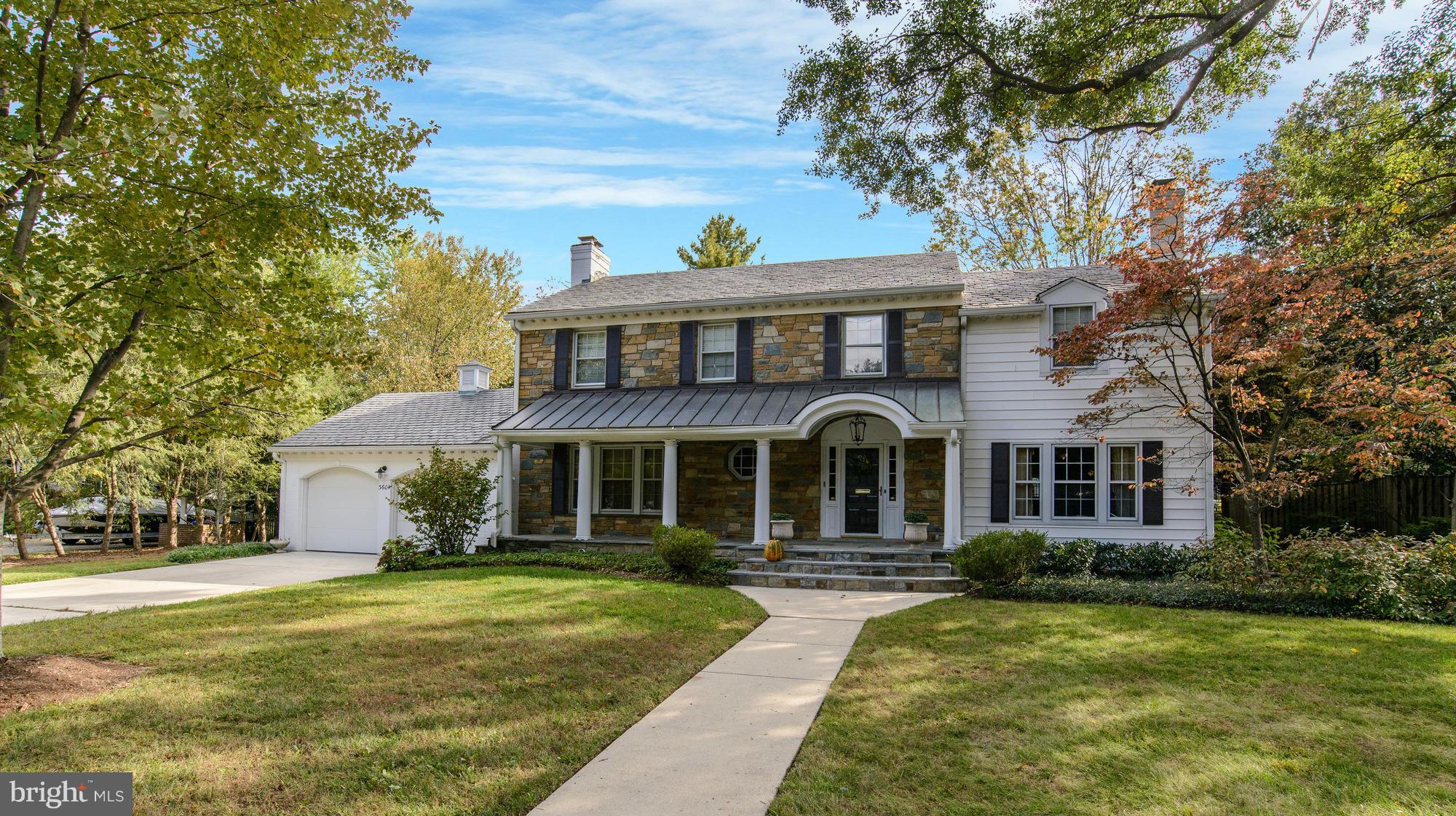 Welcoming front porch, renovated kitchen/family room, mud room, four large BRs upstairs with three FBs, master bath with two vanities + sep. tub, main level bedroom/den with full bath. Walk up attic, ll rec. room, true two car attached garage, large yard. Bright family room and sun room opening to patio, five fireplaces, gleaming hardwoods and freshly painted.