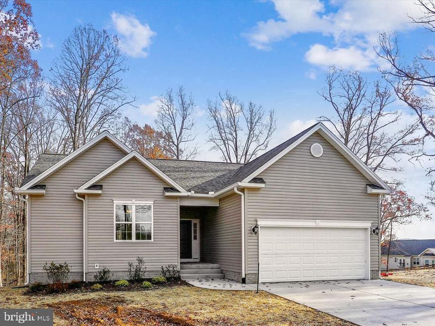 PERFECT HOME ON  PERFECT THE LOT.  GREAT PLAN FOR THOSE STARTING OUT OR THOSE DOWNSIZING.  ONE LEVEL LIVING, MAINTENANCE FREE EXTERIOR,  FULL UNFINSHED BASEMENT WITH RI PLUMBING FOR FUTURE EXPANSION OR THE ALL IMPORTANT STORAGE SPACE.   ALMOST 1 ACRE WOODED LOT IS THE PERFECT SIZE.  NO HOA. HOME IS "TO BE BUILT" -  FLEXIBLE BUILDER ALLOWS CHANGES TO FLOOR PLANS. ADVERTISED MODEL IS THE MADISON WITH THE MUCH DESIRED SPLIT BR PLAN, FEATURES 3 BR'S AND 2 BA'S WITH 2 CAR GARAGE.    BUILDER HAS PRICED 9 OTHER MODES THAT CAN BE BUILT ON THIS LOT SO YOU ARE SURE TO FIND A PLAN YOU LOVE.   
KITCHEN BOASTS  GRANITE COUNTER TOPS AND MAPLE CABINETS, ISLAND, LVP FLOORING AND MORE, LAUNDRY RM ON MAIN LEVEL.    THIS IS AN OPEN CONCEPT PLAN.  
PHOTOS MAY SHOW UPGRADES/OPTIONS NOT INCLUDED IN THE BASE PRICE. 
FLEXIBLE BUILDER CHOOSE YOUR MODEL.  
BUILDER OFFERS $3500 TO BUYER IF THEY USE ONE OF THE  BUILDER'S APPROVED LENDERS AND TITLE COMPANY.   LOADS OF INFO IN  VIEW DOCS-PLATS, FLOOR PLAN & LENDERS.