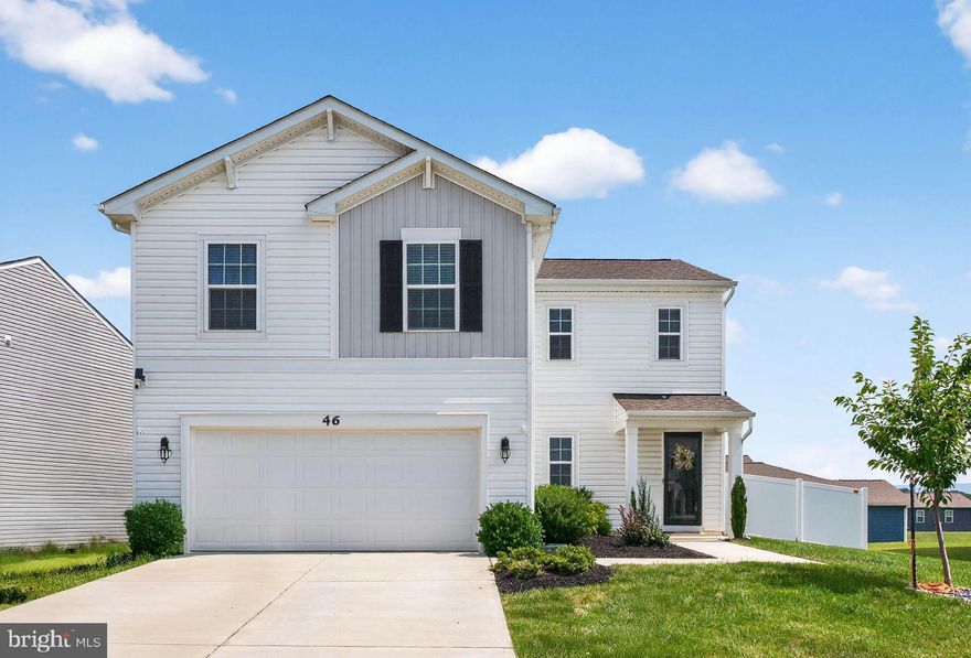 Welcome to 46 Bell Tower Lane, a beautifully maintained 4-bedroom, 2.5-bath home located in the sought-after Magnolia Springs neighborhood of Charles Town. Step inside to a bright and open main level where the living room and kitchen flow together seamlessly, perfect for everyday living and entertaining. The kitchen features granite countertops, a center island, stainless steel appliances, and a walk-in pantry, while the living area is finished with durable laminate flooring and a ceiling fan. A convenient half bath and interior access to the spacious two-car garage add function to the main floor.

Upstairs, you'll find wall-to-wall carpeting throughout and a thoughtful layout that includes a second-floor laundry room with laminate flooring and a 60+ gallon hot water heater. The primary suite is a peaceful retreat with a large walk-in closet, ceiling fan, and an en suite bath featuring a double sink vanity with granite counters and a walk-in shower. The additional bedrooms are well-sized and share a full bath, also finished with granite.

Outside, the fully fenced backyard offers privacy and a low-maintenance vinyl fence along with a concrete patio—ideal for outdoor dining or relaxing. Magnolia Springs is known for its peaceful streets, community feel, and convenient location close to commuter routes, schools, and local amenities, making this home a perfect blend of comfort and convenience.