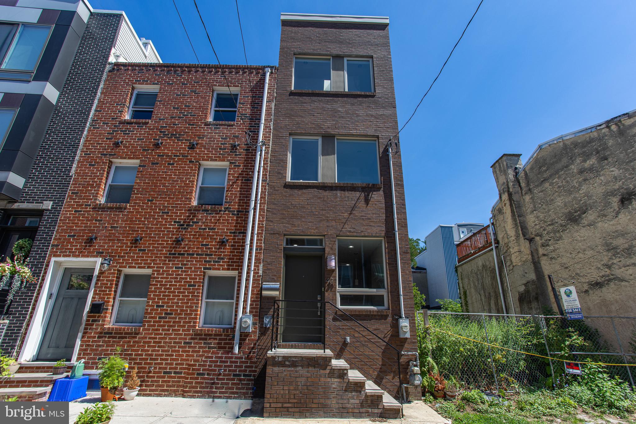 Welcome to 431 Manton Street, a stunning 3-bedroom, 3-bathroom row home in Philadelphia. As you enter, you're greeted by a bright kitchen area with beautiful hardwood floors that flow seamlessly into the modern living room. The kitchen boasts stainless steel appliances, sleek cabinetry, recessed lighting, and an inviting eat-in area. Step outside to the private patio, perfect for relaxing or entertaining guests. On the second floor, you'll find two spacious bedrooms and a full bath. The third floor is dedicated to the primary bedroom, featuring a walk-in closet, skylight, and a spacious en-suite bathroom. The finished basement provides additional living space, ideal for a home gym, office, or whatever you can imagine along with your laundry area and full bath. This prime location is just steps away from local coffee shops and great restaurants, and a short stroll to Passyunk Square and Queen Village. With easy access to public transportation and major highways, 431 Manton Street offers the perfect blend of modern living and urban convenience. Don't miss your chance to make this exceptional property your new home!
