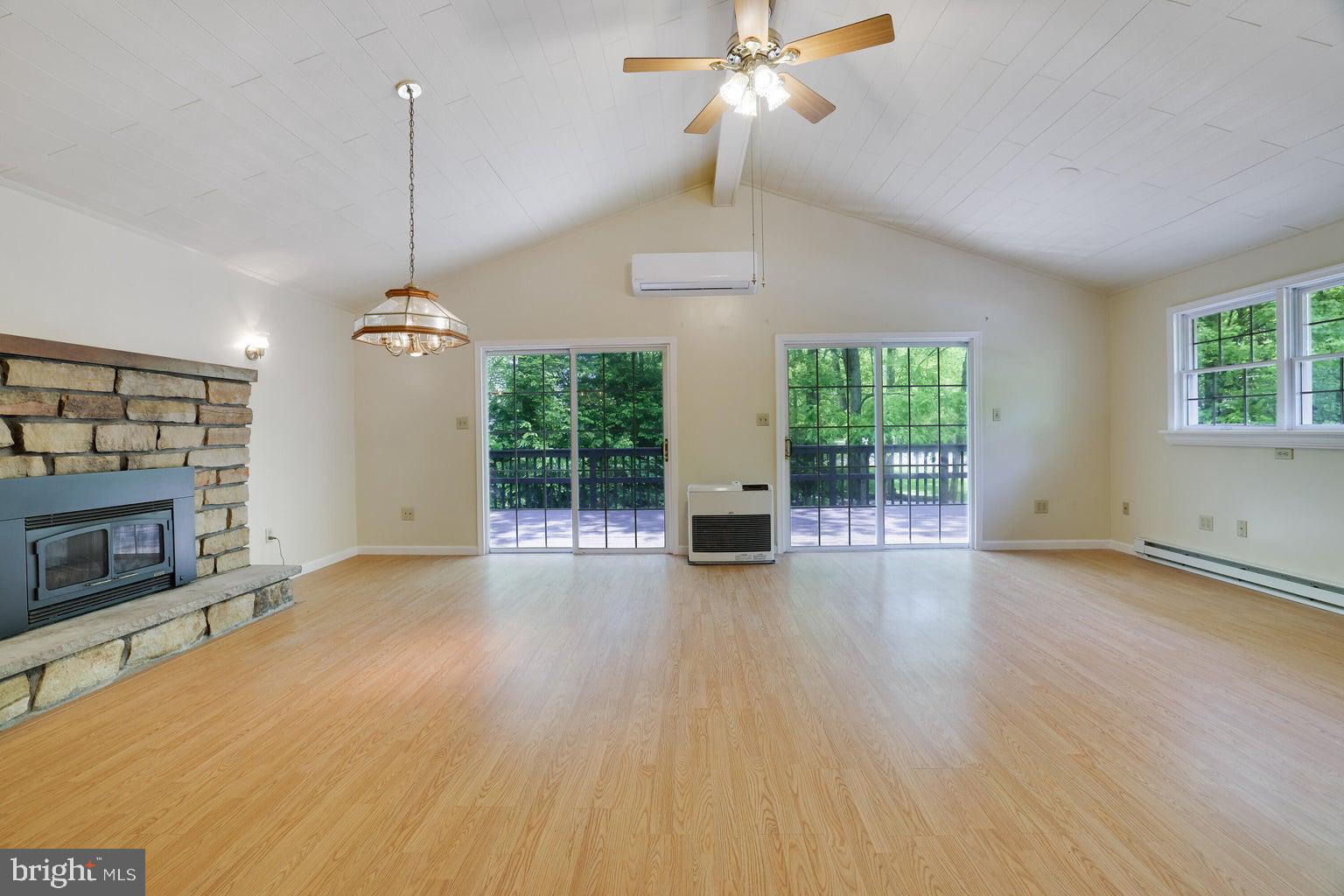 : CHARMING 4-BEDROOM HOME WITH VAULTED CEILINGS, WRAP AROUND DECK & OVERSIZED GARAGE Welcome to this spacious and inviting 4-bedroom, 2.5-bathroom home, perfect for comfortable living and entertaining. Featuring stunning vaulted ceilings and an open-concept layout, this home is flooded with natural light from the many large windows and multiple sliding glass doors. Split units for added comfort in summer and winter months. Enjoy cozy evenings by either of the two wood-burning fireplaces, conveniently located on both the main and lower levels. Step outside onto the beautiful wraparound deck, ideal for outdoor gatherings or peaceful mornings surrounded by nature. BRAND NEW ROOF ADDED IN 2024! The property also has an attached oversized garage offering plenty of storage or workshop potential, and a large circular driveway that provides ample parking space for guests and recreational vehicles. Located in an amenity filled, sought after community. Towamensing Trails offers a 190 acre lake, pool, clubhouse, restaurant and bar, tennis & basketball courts and boat rentals just to name a few things... Right in the heart of the Poconos and just minutes from skiing, whitewater rafting and downtown historic Jim Thorpe! Whether you're relaxing indoors or enjoying the outdoor living spaces, this home offers comfort and convenience!