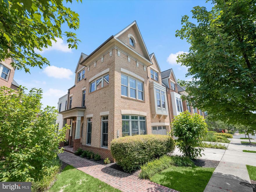 Welcome home to 7767 Tilghman Street in highly sought-after Maple Lawn! This end-of group luxury townhome built by Miller & Smith is one of the largest available in the community boasting more than 5,100 total square feet. All four bedrooms are located on the same level which is a rare find. There are two balconies offering beautiful, unobstructed views of the pond and conservation area. This property is also flanked by two serene open spaces. You’ll find elegant hardwood flooring throughout the main level, creating a seamless and inviting open-concept floor plan. The kitchen is a highlight, featuring modern quartz countertops and a stylish subway tile backsplash. An eat-in area adjacent to a large wall of windows offers access to a main level balcony, perfect for enjoying the outdoors. The living room is equipped with a cozy gas fireplace and four windows that provide stunning views. A half bath and large office are conveniently located at the front of the home, while a mudroom entrance provides easy access from the two-car front-load garage. 

The upper level presents more hardwood flooring and a spacious loft at the top of the landing. The primary bedroom boasts three large windows offering stunning views of the pond and conservation area, complemented by a generous walk-in closet. The primary bathroom is elegantly designed with a double door entrance, a soaking tub, a separate shower stall, and a dual sink vanity. The three secondary bedrooms are also bright and airy, each with multiple windows providing ample natural light. A shared hallway bathroom includes a dual sink vanity, and a convenient laundry room completes the upper level. The lower level offers a a sun-drenched recreation room with full windows. You’ll find luxury vinyl plank flooring in the versatile “bonus room,” ideal for a home gym or guest room. You’ll also enjoy another full bathroom, two storage closets, a utility room, and access to a balcony. Conveniently located close to all major Baltimore/DC commuter routes, and with enviable amenities including a resort-style community pool, tennis courts, pickleball courts, basketball courts, state-of-the-art gym and more, you’ll quickly see why Maple Lawn is an award winning planned community unlike any other in Howard County. This class of townhome is rarely available and a true gem in this highly coveted community.