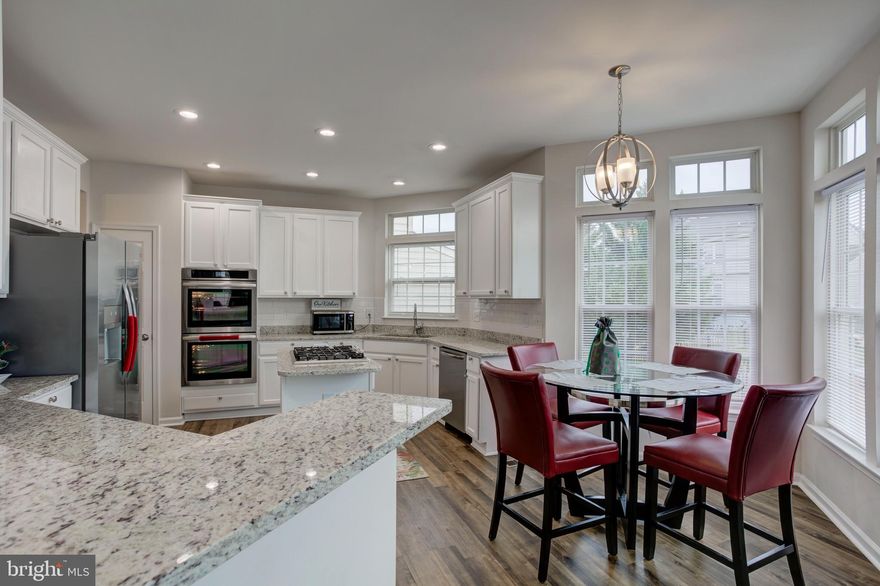 Welcome home to this amenity-filled Lee's Parke community. The Kitchen is bright and sunny with granite countertops and stainless appliances. Elegant columns separate the Living Room and Dining Room. The Family Room is cozy with a gas fireplace and offers views of the backyard. Upstairs has four 4 oversized Bedrooms including the Primary Bedroom and Primary bath on-suite. Finished Basement with walk-up to the fenced in backyard and large oversized deck accessible from kitchen and basement. Enjoy.