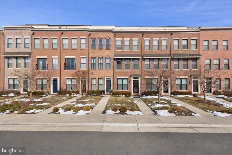 Welcome to the heart of Brambleton Town Center, where convenience meets elevated design in this beautifully upgraded 3-bedroom, 3-bath townhouse offering nearly 2,000 square feet of thoughtfully curated living space. Tucked within one of the area's most walkable communities, a charming neighborhood path leads directly to the Brambleton Shopping Center — placing the movie theater, OneLife Fitness, restaurants, coffee shops, groceries, and everyday essentials just moments from your front door. It simply doesn’t get more convenient than this location. Enjoy a short stroll to multiple county parks, playgrounds, splash pads, and a dog park with Dulles International Airport just a quick drive away for effortless travel. Inside, the home reflects the eye and expertise of its owner — an interior designer who carefully selected upgrades throughout. Freshly painted and move-in ready, the home features rich hardwood floors, marble countertops, upgraded stainless steel appliances, and a generous dining space perfect for entertaining. The living room showcases custom niche shelving, adding both style and function. Upstairs, the spacious primary suite offers dual closets and a spa-inspired bath with double sinks and marble counters. Additional highlights include dual-zone HVAC for year-round comfort, two outdoor spaces, a gas hookup for grilling, and a two-car garage for convenience and storage. Thoughtful design, everyday functionality, and an unbeatable location combine to offer a true Brambleton lifestyle.