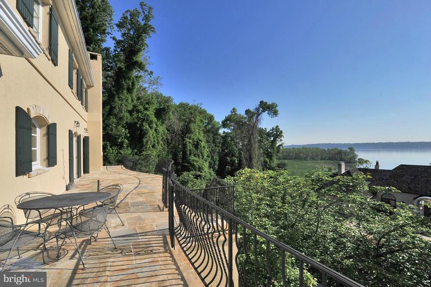 A bit of Tuscany on a hillside in Alexandria overlooking the Potomac. Located on a private drive of custom built homes. This one of a kind Villa offers a European ambiance and quality construction. Each room on the main level opens to the 64 x 14 ft stone terrace, which is a great gathering sport with abundant views of the River. High ceilings and luxurious finishes throughout.