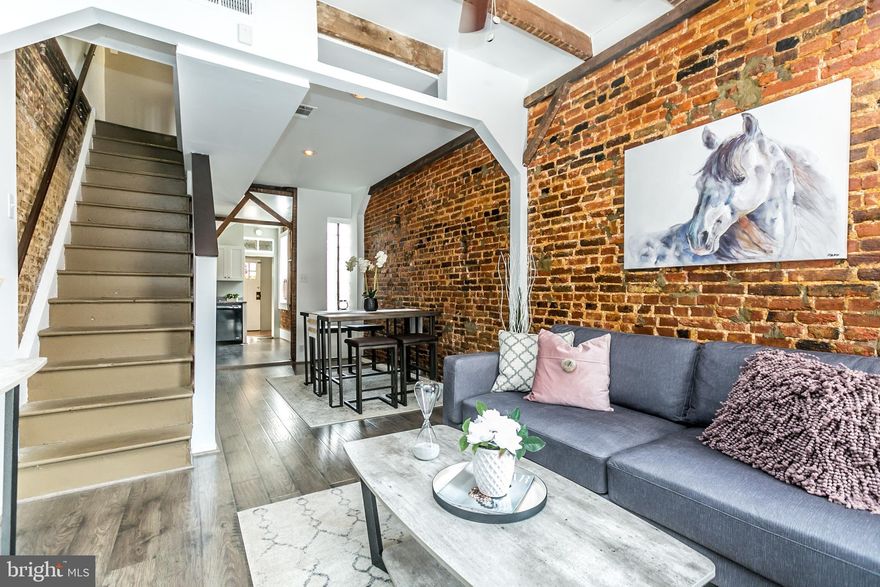 This Fells Point home is a true SHOW-STOPPER! This home literally has everything you want right down to it's awesome Fells Character! You will love the exposed brick and beams, wood flooring, fenced yard AND ROOF DECK, huge master suite with vaulted ceilings and second bedroom with en-suite bath and roof-deck access, stunning kitchen with granite and new cabinets, W/D in unit and LOTS of extra STORAGE! For a 2 bed, 2 bath with roof deck and all the amenities, you can't beat this price! CALL TODAY!