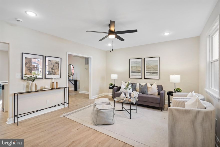 Best Value in Waverly - Brand new top to bottom! From the moment you step onto the welcoming covered front porch, you'll feel right at home in this beautiful, newly renovated residence in the heart of Waverly. Inside, the sun-filled main level boasts a spacious living room, a bright eat-in dining area, and a designer kitchen that’s sure to impress. Featuring shaker-style cabinets, quartz countertops, and a large center island. Just off the kitchen, enjoy seamless indoor-outdoor living with access to a large covered rear porch. Upstairs, you’ll find three generously sized bedrooms and a custom tile bathroom. The fully finished basement offers incredible flexibility with a true fourth bedroom, second full bathroom, laundry area, and utility space—ideal for guests, a home office, or additional family living. Out back, there is a large, fenced in backyard. Don’t miss your chance to own this thoughtfully renovated home in one of Baltimore's  most desirable neighborhoods. Schedule your private tour today!