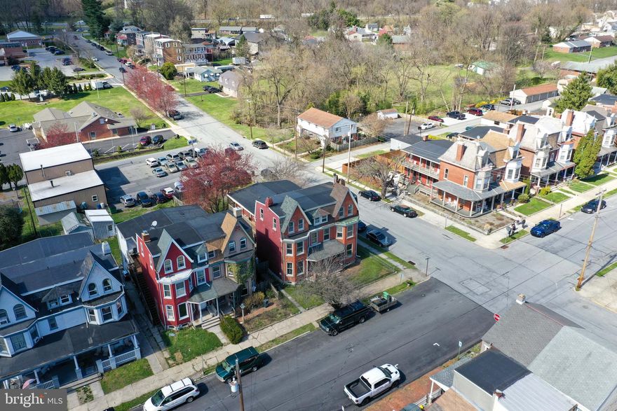 Don’t miss the opportunity own this Columbia Boro masterpiece. Sitting on a corner lot stands this 3-story Duplex featuring 5 bedroom, 2 full baths, and nearly 2400 square feet. It combines the perfect mix of modern conveniences and historic charm. Full of character, pride, and prominence. It features original hardwood floors, antique hardware, and lovely surprises around every turn. The eye-catching brick and stone exterior leads through the front door an into the grand foyer with staircase. The hardwood floors and cozy feel continue into the family room that shines with French doors, high ceilings, wood burning fireplace, and large windows that let in lots of natural light and provide street views. A formal dining room comes complete with built-in corner cabinet and walk-in storage under the stairs. The kitchen is wonderful with hardwood floors, new granite countertops, tile backsplash, and lots of cabinet and counter space. Cooking is a breeze with GE refrigerator, stainless steel sink with garbage disposal, dishwasher and Samsung electric range. There is also a new stacked LG washer and dryer. A bonus is the 2nd staircase in the kitchen to the upper level. A lovely side porch/deck is accessible from multiple rooms, a great space for entertaining. The upper-level hosts 3 spacious bedrooms, large windows with natural light, and an upgraded full bath with tub/shower combo. A bonus is a large, covered balcony, an excellent place to relax and read a book or watch all the excitement Columbia has to offer. The next staircase leads up to the 3rd floor boasting 2 spacious bedrooms. The lower level is unfinished but is very spacious, has storage space, room for a workshop, and has access to the back yard. The exterior is incredible with front and side porch, fenced-in backyard with patio, firepit, garden, horseshoe pit and more. Excellent location close to Route 30, an easy commute to York and Lancaster. Plus, close to all the dining, shopping, and entertainment. Plus, close to the Susquehanna River for boating, jet skiing, and fishing. Don’t wait, this gem won’t last long. Schedule a showing today!