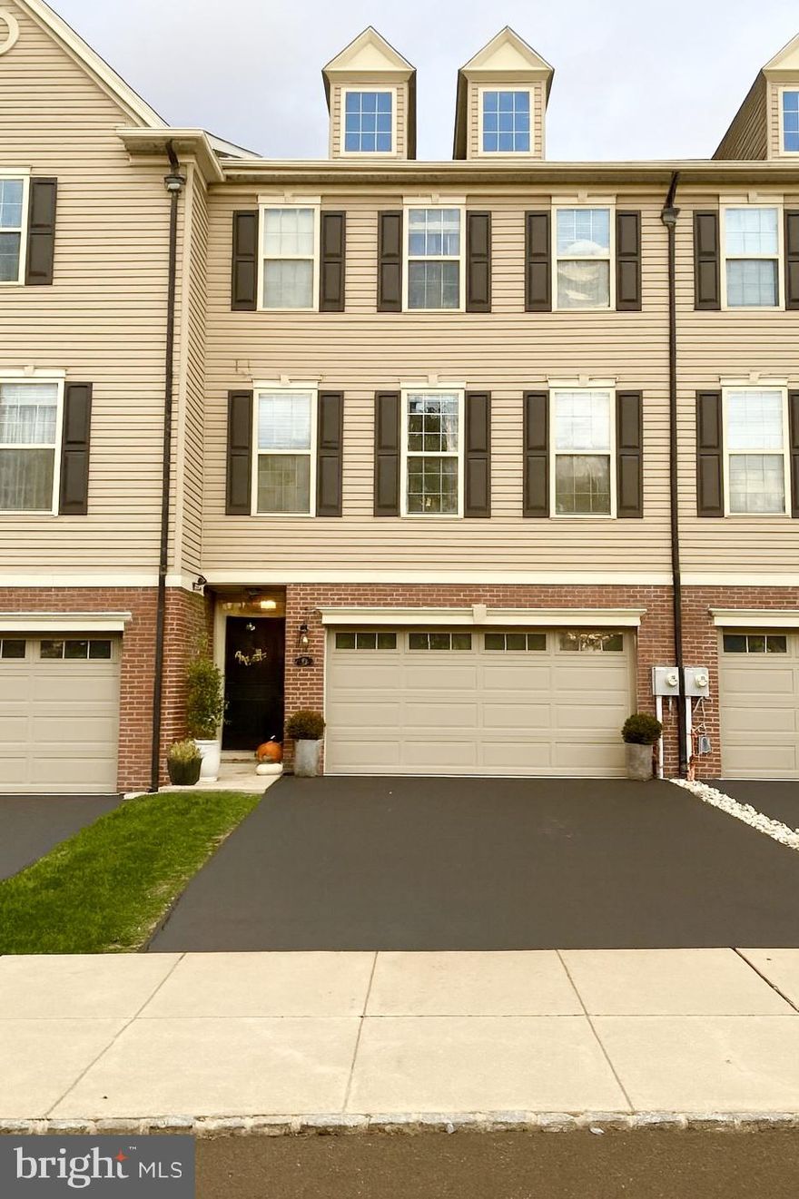 A beautifully maintained and thoughtfully upgraded townhome in the desirable Emerald Pointe community of Feasterville, PA. Nestled within an enclave of only 33 homes, this elegant three-story residence combines modern design, functionality, and low-maintenance living.

Situated at the apex of the community, this home enjoys a unique setting with no homes directly in front or behind. The backyard opens to a wide grassy field—perfect for play or peaceful evenings outdoors. Beyond the field sits a charming historic stone farmhouse, known locally as “The Mansion,” once belonging to the original owners of the land where Emerald Pointe now stands. The view of this timeless landmark enhances the serene, picturesque backdrop of your outdoor space.
Inside, the home features 3 bedrooms, 2 full baths, and 2 half baths, along with a 2-car garage and numerous custom upgrades that set it apart from others in the community.

The entry level includes the garage, a spacious recreation room, and a custom half bath. The garage itself is a standout feature, offering a walk-in coat and shoe closet—a rare addition that keeps the main entry neat and organized. The epoxy-coated garage floor adds a sleek, modern finish.

On the main floor, enjoy an open-concept living and dining area with freshly painted walls, elegant ogee wall molding, and a custom-built modern electric fireplace—a perfect centerpiece for cozy gatherings. The kitchen includes a breakfast nook with custom built-in bench, creating an inviting space for everyday meals or activities. A renovated powder room and newer vinyl flooring (installed 2020) complete this level.

Upstairs, the bedroom level offers three comfortable bedrooms and two full baths. The primary suite features a private bath and walk-in closet. The hall bath was fully renovated in 2024, showcasing a new vanity, modern bathtub, upgraded fixtures, recessed lighting, and stylish tile. All bedrooms feature new laminate flooring (installed January 2024), making the entire home carpet-free—creating a hypoallergenic environment that’s easy to clean.

Outdoor living is equally inviting with a large cement patio—smooth-finished for a modern look—and an upper composite deck, perfect for entertaining or relaxing while enjoying peaceful views of the open field and historic farmhouse beyond.

Throughout the home, you’ll find upgraded lighting fixtures, designer trim, and custom touches that elevate every space.
Living in Emerald Pointe offers the best of both worlds: the privacy and comfort of a well-built home with the convenience of HOA-maintained exteriors, landscaping, and snow removal.

The location is ideal—minutes from I-95, the Pennsylvania Turnpike, and Route 1, with quick access to shopping, restaurants, banks, medical centers, and everyday essentials. It’s a peaceful nook in the heart of Feasterville, perfectly positioned for convenience and community.

Lovingly cared for by its original owners, this home has been a place where thoughtful design meets warmth and practicality. With tasteful upgrades, a prime lot, and a layout ideal for modern living, it is ready to welcome its next chapter.

Home may also be available partially or fully furnished upon request, offering a convenient move-in-ready option for interested buyers.

Experience the perfect blend of elegance, functionality, and comfort—a home that truly stands out in one of Feasterville’s most sought-after neighborhoods.