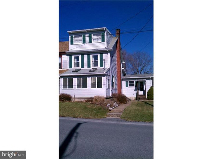 Enjoy country living in this large semi with central air conditioning in the Borough of Leesport on an almost 1 acre lot. Large Eat-in Kitchen with Quaker Maid cabinets, built-in range and dishwasher.  Convenient laundry room on 1st floor with direct access to the rear yard.   Relax in the three season sun room with Hot Tub or on the adjacent wooden deck!  First floor office includes built-in bookshelves. Enclosed front porch with windows and skylights make the perfect plant growing room.  The second floor includes two large bedrooms and additional third bedroom on the third floor.  Detached two car garage includes 24 ft x 9 ft workshop. The electric system was recently upgraded to a 200 amp service. Ample storage in several sheds for outdoor furniture and lawn & garden equipment.