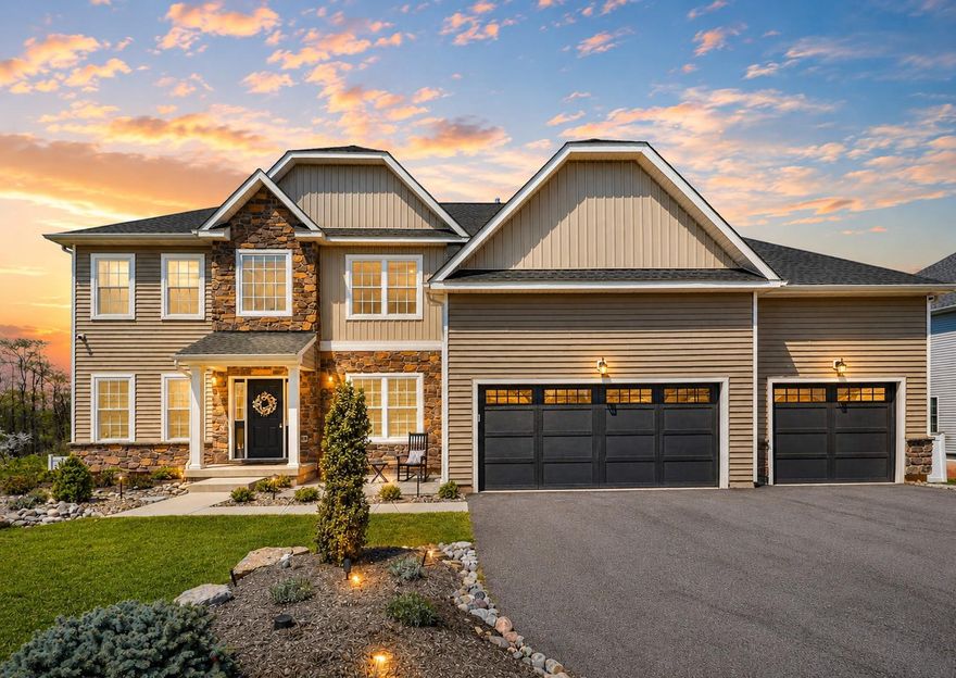 Positioned on one of the most desirable homesites in the Estates at Saucon Valley community, this home offers rare privacy and uninterrupted valley views. Spanning over half an acre, the property delivers a truly exceptional setting. The first floor is anchored by a two-story family room with expansive windows framing the views, a gas fireplace, and an open staircase that defines the space, all connecting seamlessly to the kitchen. The kitchen is centered around an oversized island with abundant cabinetry and a layout designed for daily use and entertaining. Upstairs offers four generously sized bedrooms with custom closet shelving and the convenience of second floor laundry. The owner’s suite provides a comfortable retreat with a well-appointed bath including a soaking tub, tiled walk-in shower with bench, double vanity, and a spacious walk-in closet. The finished walkout lower level adds flexible living space, ideal for a media room, gym, or guest area, complete with a full bathroom. Built for modern living, the home features fiber powered internet, whole home mesh WiFi, and hardwired connectivity throughout. A comprehensive security system with lighting automation adds convenience and peace of mind. Two dedicated home theater spaces and a deck prewired for TV, audio, and internet create a seamless indoor-outdoor experience. The outdoor setting is expansive and private, creating a scenic backdrop. Located in the Southern Lehigh School District, just minutes from Saucon Valley Country Club, The Promenade Shops, and major commuting routes, this home delivers a rare combination of privacy, views, and turnkey condition.