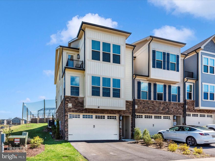 Available this May, luxury living in Oakdale Village! This spacious four bedroom, five bath end unit townhome features an open floor plan with an upgraded kitchen, sun filled living area, and a covered rear deck overlooking the ball fields and scenic views. Upstairs offers three generous bedrooms, including a balcony with exceptional views as well. The lower level includes a private bedroom with en suite bath, powder room, mud area, ample storage, and a two car garage with an EV charging outlet. Enjoy the upscale comfort of the Springhill model by NV Homes and the sought after amenities of Lake Linganore. Walkable to Oakdale schools, community pool, trails, tot lots and the developing shopping center. Easy access to I-70, Route 270, and downtown Frederick- this one you won't want to miss!