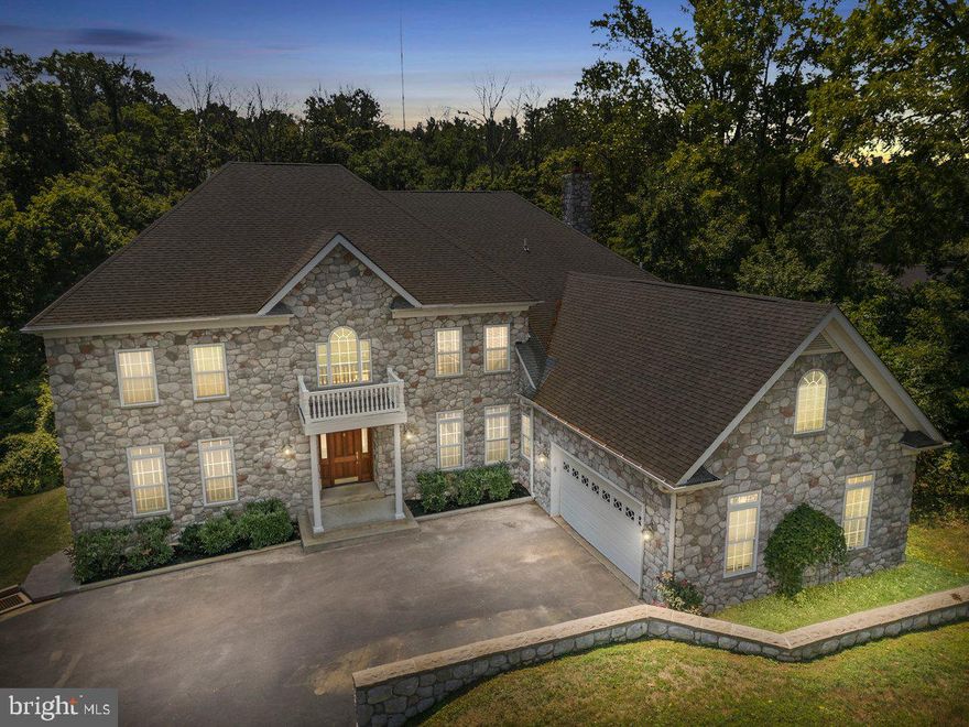 Stately Stone Front Colonial Manor Home on 1.27 Acres in Beautiful Newtown Square. This Gorgeous and Dramatic Residence Boasts over 7,000 square feet in a Secluded Setting with a Scenic Wooded Backdrop, and includes a Huge Rear Deck overlooking the In Ground Pool with lots of privacy. Very impressive feelings as you walk through the front door and experience the Two Story Center Hall and look straight ahead to the dramatic Two Story Family Room with a Stone Fireplace. The Large Living Room, and Formal Dining Room will excite you for large gatherings, as will the Beautiful Kitchen with Butler Pantry, Granite Island and Counters, and high end appliances. This main level also includes an Office, a Study, a convenient Powder Room, and a rear staircase. The Second Floor Features the Primary Bedroom Suite that includes a two way fireplace, walk in closet, and the primary bathroom includes a double sink vanity, whirlpool tub, separate shower, private water closet, and a large storage room with laundry facilities. The Second Bedroom has it's private Bathroom, and Bedrooms 3 and 4 share the Hall Bathroom with a double sink vanity. The walk up 3rd floor provides a huge  storage space. Let's check out the Finished Walk Out Basement with the Massive Recreation Room with a Performer's Stage, Stone Fireplace, Large Powder Room, Separate Fitness Room that can also make a Great Home Movie Theater, a Cool Hobby Room, and lots of storage space including the utility room. The rear walk out leads to the Salt Water In Ground Pool and time to enjoy the outdoor experience. More fine features include Hardwood Floors, Freshly Painted Interior, Ceramic Tile Flooring, Crown Moldings and Wainscoting, Large Heated Two Car Garage, Interior Sprinkler System, A Generator, and Handsome Curb Appeal, all located in a quiet and friendly neighborhood with geographic convenience to all the amenities that Newtown Township has to offer with Parks, Athletic Fields, Great Restaurants, Shopping Centers, and Major Traveling Routes. Welcome Home to Many Years of Happy Memories ! **Special Note** If the new Buyer appeals the current tax assessment, the new taxes can be approximately $10,500. Ask listing agent for specific details.