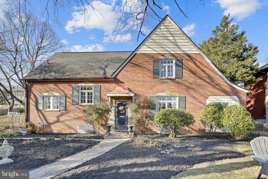 This large, classic, and charming brick and stone Tudor style home has massive curb appeal and is located on a beautiful tree-lined street in Waverly Hills! Enter the two story paneled foyer with a gorgeous staircase that winds upstairs. To the right, enter the huge living room with floor to ceiling wainscoting, built in bookshelves, and a wood burning fireplace. Off of the living room is a light filled sunroom with original flagstone flooring and bead board ceiling. In front of the foyer, enter the large dining room with tray ceiling, chair rail, two built in china cabinets, and french doors that lead into the family room. There are original pegged and grooved hardwood floors in foyer, living room and dining room. To the left of the foyer, head into the kitchen with a small hall powder room and large pantry along the way. The kitchen is a wide galley kitchen with a breakfast bar for a cup of coffee or casual meal. An addition,  added around 2000, includes a large family room with cathedral ceiling and two more rooms, which can be used as bedrooms, office space, home gym, etc. There is also a full bath, making this area perfectly private for visiting guests, in-laws or nanny/au pair. There is an outside exit to the backyard from these rooms. Hardwood floors were installed in the addition and kitchen. When you head upstairs, you'll notice the large landing where you'll find the washer/dryer closet and a cedar closet storage! To the left, you find the owner's suite with a newly renovated marble bathroom with large shower and water closet. There are two large closets in this bedroom. The hall bath has a tub/shower and was also recently renovated including marble flooring, quartz countertops and heated towel rack. There are two more bedrooms upstairs, and one of them leads into a bonus room, which can be used for a playroom/sitting room/or home office. The possibilities are endless! The lower level is completely unfinished, has great storage space, and includes a washer/dryer hookup and plumbing for a half-bath. There is a door at the bottom of the stairs where you access the two car garage. The lot is considered oversized for North Arlington and the house is sited on a dead end county street, offering plenty of parking. You can't beat the location! So close to DC, all airports, Metro and bus routes, bike trails, and walkable to Lee Heights, Ballston, Virginia Square and even Clarendon! Glebe/Dorothy Hamm/Washington-Liberty school district.