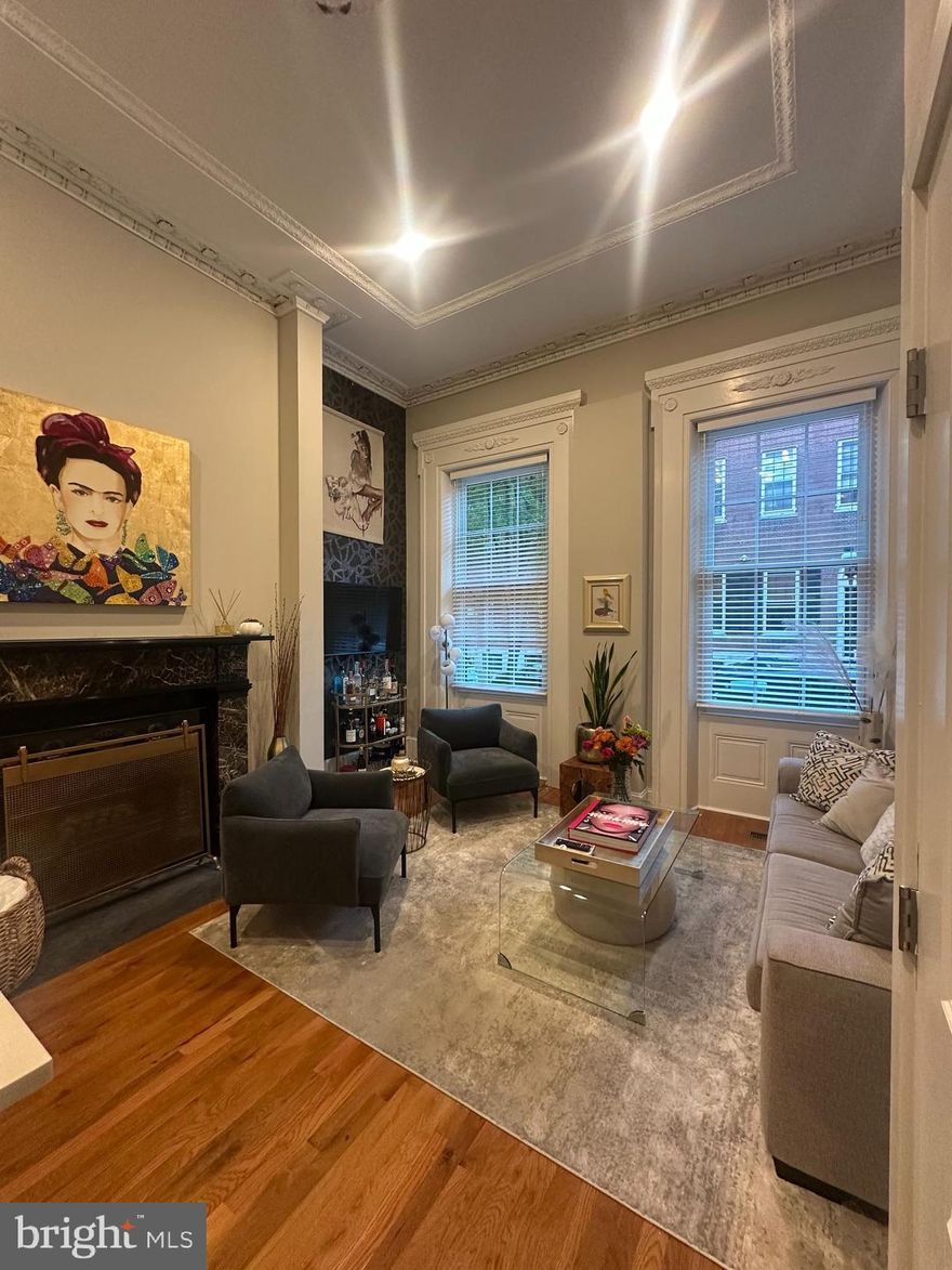 Stunning 1 bed, 1 bath totally renovated at 1015 Clinton Street, a beautifully rehabbed classic Philadelphia Historic Mansion. 15 lease minimum.  Enter this first floor, Clinton street facing unit with soaring ceiling and  breathtaking crown molding. The unit is only a few years old with new hard wood floors, outdoor space, working fireplace, chef's kitchen with granite counters, breakfast bar, stainless steel appliances, gas cooking, dishwasher, garbage disposal, built-in microwave, lots of cabinets, and laundry in unit. New bathroom with tub, ceramic tile surround & floor.  The bedroom is large with a decorative fireplace and loft space for storage.  The unit has its own designated outdoor space right outside the unit. Parking space is available for an additional $330/month and is located just a few blocks away at Spruce and Juniper (outdoor lot). This spot is rented by the current tenant that can be transferred to a new tenant.  Landlord provides cold water. Tenant pays electric, gas heat, gas cooking, gas hot water. Cat friendly. Requires first month rent, last month rent & 1 month security deposit due up front at lease signing. Close to Pennsylvania, Wills Eye and Jefferson Hospitals, public transportation, I95, 76, shopping, restaurants and all that the city has to offer. Transportation, I95, 76, shopping, restaurants and all that the city has to offer. Inquire for video walkthrough!