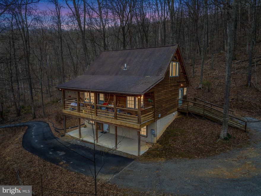 Take a look at this stunning cedar-sided chalet nestled in the woods, with deeded river access.
This beautiful cedar home is what you have been waiting for, high quality construction with solid wood floors, pine cathedral ceilings, solid wood trim and doors. Large windows throughout showcasing the beautiful natural scenery.  Spacious great room with fireplace propane (Trane) insert. Two bedrooms with easy room for 3 or more. 2.5 baths, roll in shower access on lower level and main entry ramp. Ground-floor family room, recreation room, or a space with countless opportunities to personalize.  Enjoy the nice covered front porch for those evenings after a day on the river.  Perfect for vacation getaway or full-time living.  Come out for a look today, you won't want to miss this beauty.