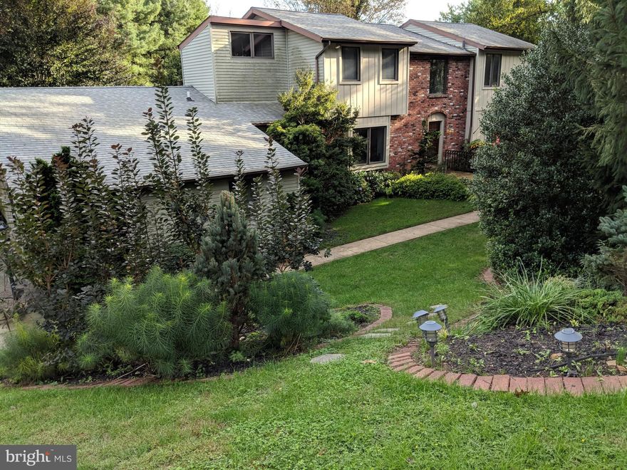 Four Bedroom  Colonial home in the highly sought after TE School District in Wayne. Location is closest in Wayne to Philadelphia. Curb appeal of Zen gardens greet you as you approach the front door of the home. The two-story foyer and the gleaming hardwood floors of the entire main level lead to the Formal Living and Dining rooms. The cozy Family room with a beautiful red brick fireplace and Built-in shelves and exposed beams make a great gathering place. The kitchen has plenty of cabinets, Propane Gas cooking range and stainless steel appliances and is just off the dining and family room with a Breakfast nook opening onto the  deck and the fenced in backyard. The Pantry and closets line the Mudroom that leads to the main floor Laundry and Powder room. The Study / a fifth Bedroom completes this main level. The Master bedroom suite with Vaulted ceiling, walk-in closet and attached Bath with walk-in shower, heated floors, updated vanity and window to let in the natural light. There are three additional large bedrooms and the hallway bath. Two-car attached Garage, Newer carpet, Fenced yard, quiet serene neighborhood on the main line, close to the Train station, Highways, shops and restaurants,