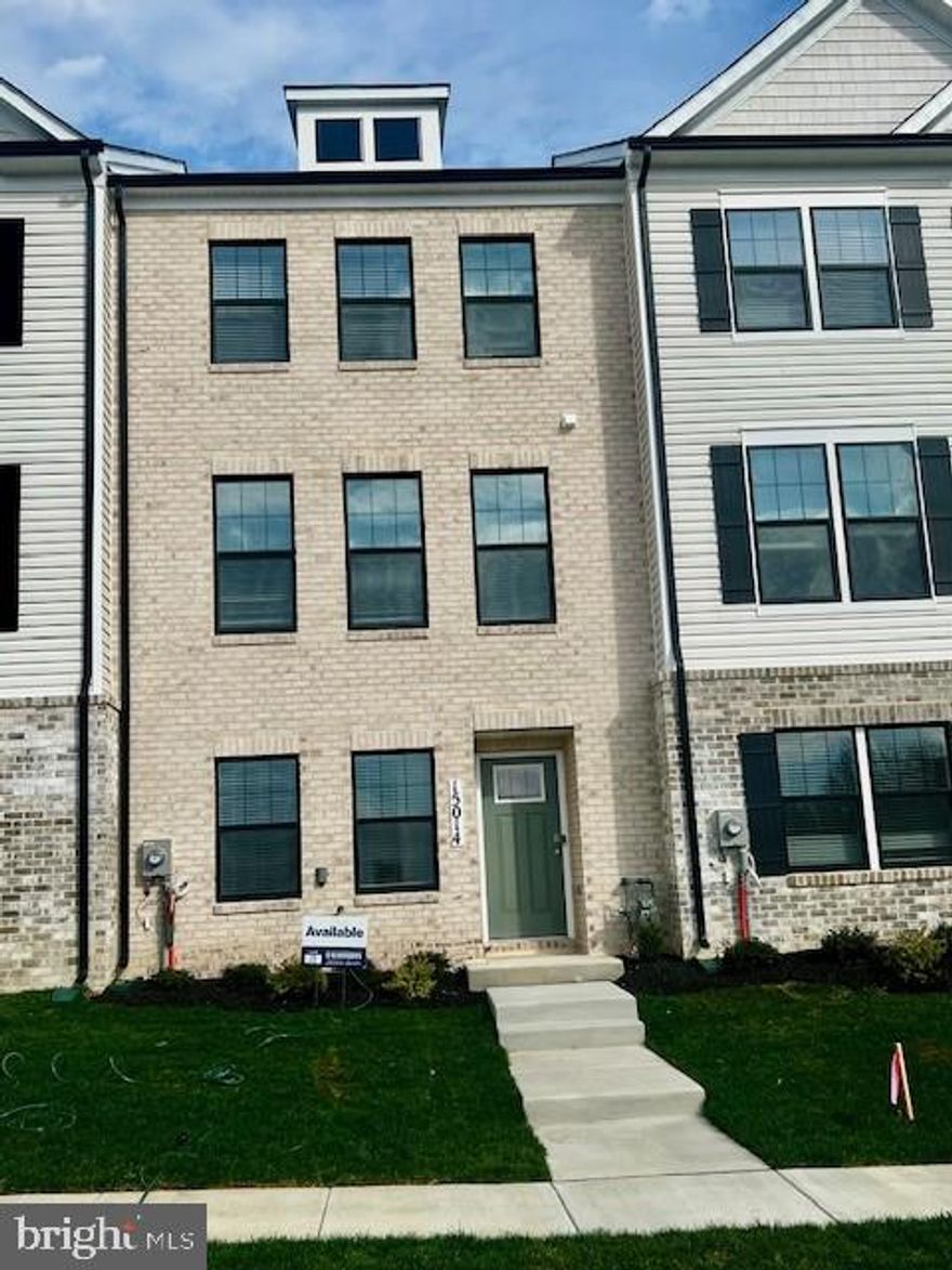 This 3-story open and contemporary middle unit floorplan encompasses 4 bedrooms, 3.5 baths, and a 2-car rear load garage. Thoughtful design and modern luxury are uniquely embodied in this townhome plan, which features 1,763 sq ft of living space. This home offers a spacious main level eat-in kitchen with upgraded white cabinets, quartz countertops and stainless-steel Whirlpool appliances. Recessed lighting and blinds are provided throughout the home as well. The upper level boasts a private laundry closet and stylish primary bedroom, complete with a walk-in closet and dual vanities.  Two spacious additional bedrooms are also included on the upper level.   The lower level features a finished recreation room that can double as a 4th guest suite, along with a full bath. Black windows, gutters and garage door presents this home with stunning curb appeal to boast an urban and modern feel that is sure to stand out.