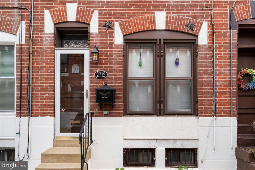 Welcome to this stunning home in the heart of Grays Ferry! Completely rebuilt in 2002, with the exception of the historic brick facade, this well-designed 2 bedroom, 1 bathroom interior row home is truly a gem. The property is rented through Summer 2025 and would make an ideal investment.  As you enter, you'll be greeted by the comfortable living room, bathed in natural light that accentuates the beautiful hardwood floors. The living room seamlessly connects to the eat-in kitchen, creating a perfect space for entertaining and everyday living. The kitchen features stainless steel appliances and plenty of cabinet space to store all your culinary essentials. The large rear patio is accessible directly from the kitchen. This outdoor oasis is ideal for grilling, hosting gatherings, or simply enjoying a cup of coffee in the morning sun. Upstairs, you'll find two bright and airy bedrooms that share a full hall bathroom. Additionally, a linen closet in the hallway provides convenient storage for linens and towels. The full basement of this home offers ample storage space and includes a laundry area with a washer and dryer, adding the convenience of being able to do laundry in the comfort of your own home. Located on a quiet block in Grays Ferry, this home provides a tranquil escape from the hustle and bustle of city life. Enjoy the serenity of the neighborhood while still having easy access to nearby amenities, parks, and transportation options. Don't miss the opportunity to schedule a showing and experience the historic charm and modern comforts this home has to offer!