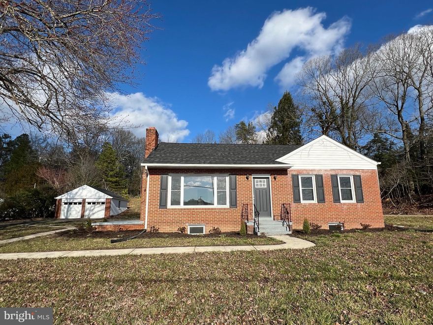 All brick rambler with detached 2 car garage.  Completely remodeled.  New kitchen & appliances, bathrooms, flooring, paint, fixtures & windows.     Close to restaurants, shopping, PAX River and Solomon's Island.  Great location for home office.