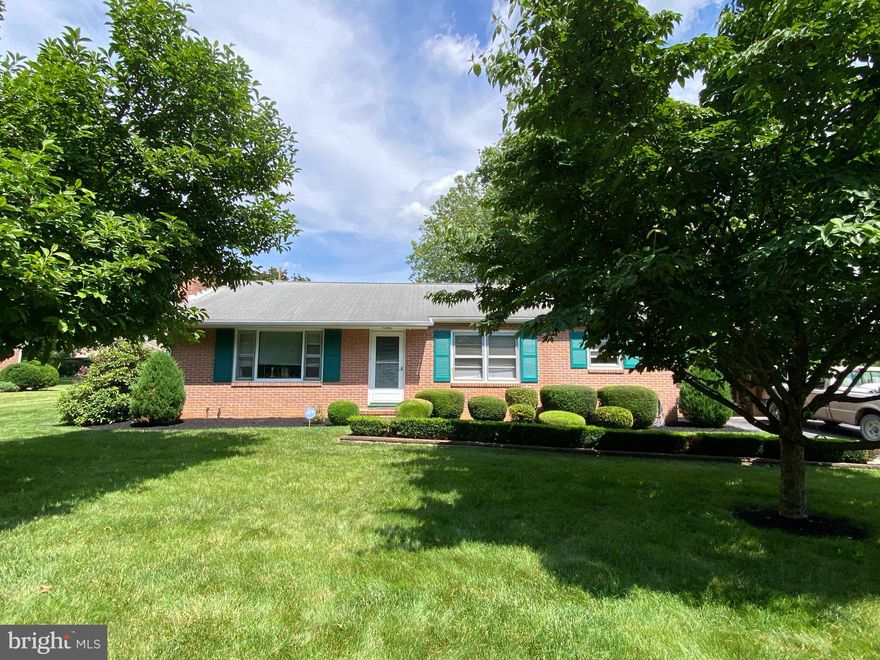 BRAND NEW KITCHEN just completed.  All new cabinets, new counters, flooring, lights, appliances and a kitchen island with butcher block.  This Charming all-brick 3-bedroom, 1.5-bath rancher offers timeless appeal! Step inside to find hardwood floors throughout most of the main level, a wood burning fireplace for added heating. 3 bedrooms, a full hall bath and the primary bedroom with a half bathroom. Enjoy easy living with everything you need on one level. The finished lower level is perfect for a family room, home office, or gym with lots of storage and laundry. The home also features a 1-car garage, a lovely backyard ideal for play or gardening, and a relaxing patio with retractable awning for outdoor entertaining or bird watching. Come see this beautiful mature community with easy access to the highway, shops, and just 1 mile to the Fountainhead Golf Course and Country Club.  A solid home with great bones—don’t miss this opportunity!