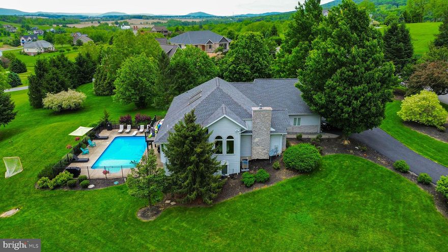 Spectacular Ranch Home on 1.29 Acres – A True Entertainer's Delight!

This beautifully designed ranch home offers the perfect blend of luxury, comfort, and functionality—all nestled on a scenic 1.29-acre lot with stunning views in every direction. With a fully finished lower level, a sparkling outdoor pool, and spacious living areas, this home is perfect for entertaining or simply relaxing in style.

The main level boasts a brand-new custom kitchen, an open-concept layout with access to a view-filled deck, and a luxurious owner’s suite complete with an upgraded en-suite bath and custom closet. Two additional bedrooms and a full bath complete this level.

Upstairs, you’ll find a private bedroom and bath—ideal for guests or a home office.

Head downstairs to discover a fully finished basement featuring a custom bar, a large recreation room with walk-out access to the pool area, and a second versatile recreation space currently used as a gym. Two more bedrooms and additional bathrooms provide flexible space for guests, hobbies, or multi-generational living.

With thoughtful upgrades throughout and space for everyone, this home is as versatile as it is beautiful. The pool is open and ready—just in time for your first swim of the season!

Buyer to verify room measurements and square footage.