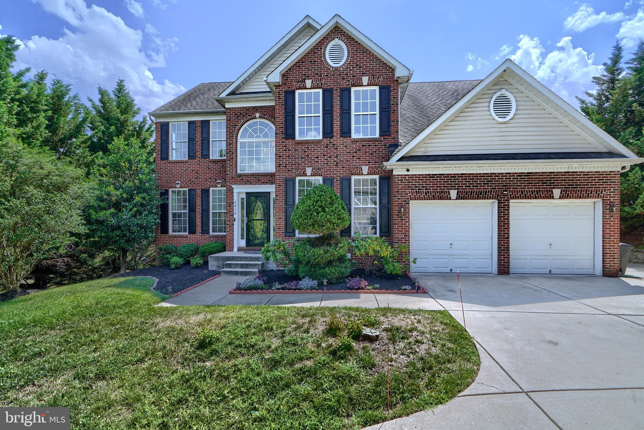 FRESH PAINT THROUGHOUT ENTIRE HOME. 2 BATHROOMS JUST REMODELED. Welcome to this gorgeous 4-bedroom brick front home featuring a grand 2-story foyer. Just off the foyer, you'll find a home office with French doors and an impressive 2-story living room. The separate dining room, accented by stately columns, is perfect for formal gatherings. The spacious eat-in kitchen boasts warm wood cabinetry, a large center island, stainless steel appliances, granite countertops, a beautiful tile backsplash, soft-close cabinets and drawers, a separate wine bar, and a large pantry. The kitchen opens to a large Trex deck through sliding doors. Adjacent to the kitchen, the family room offers plenty of natural light through its large windows and a cozy fireplace. Hardwood floors adorn most of the main level, which also includes a main level laundry and half bath.
The home features a two-sided staircase leading to the upper level, which overlooks both the foyer and living room. The upper level has a hall bath with a dual sink vanity and four bedrooms, including a spacious owner's suite with a huge closet and a sunlit ensuite bath with a dual sink vanity, separate shower, and large soaking tub. The expansive finished lower level includes a large multifunctional area, a full bath, an additional room for a second home office or bedroom, and a walkout to the patio and backyard.
This immaculate, well-maintained home shows pride of ownership throughout. Situated down a long driveway on a large lot, it offers lots of privacy, making it a serene retreat.