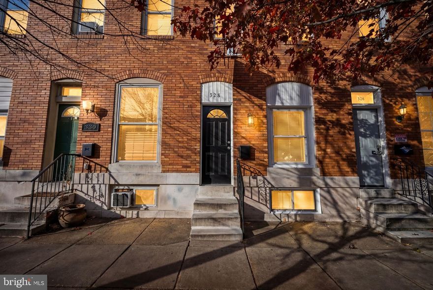 Welcome to 328 S Macon St, this beautifully renovated home offers 3 bedrooms, 3.5 bathrooms, and modern upgrades throughout. Step inside to an open-concept main level with brand new flooring, freshly painted walls, and a spacious living area perfect for relaxing or entertaining. The kitchen features granite countertops, stainless steel appliances, and plenty of cabinet space. A convenient half bath is also located on the main floor. Upstairs you’ll find two bedrooms, each with its own private full bathroom, offering comfort and privacy. The fully finished basement includes a third bedroom and another full bathroom, ideal for guests or additional living space.  Outside, the fenced backyard offers a private parking pad a rare find in the area! Located just minutes from Patterson Park, Canton Square, Johns Hopkins, shops, restaurants, and major commuter routes, this home checks all the boxes. Move in ready and fully renovated don’t miss your chance to call this home!