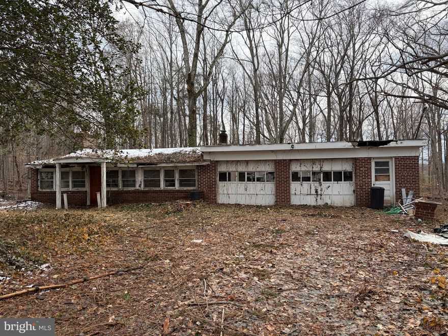 Being sold strictly AS-IS. Great opportunity for investor or builder. almost a 1/2 acre lot in a Manassas location. Existing 2 bedroom 1  full bath single family home with large garage  . Located just off 234 bypass.  Only 10min from  Old Town Manassas VRE Station, making this location perfect for  dream home. PICTURE AI GENERATED.