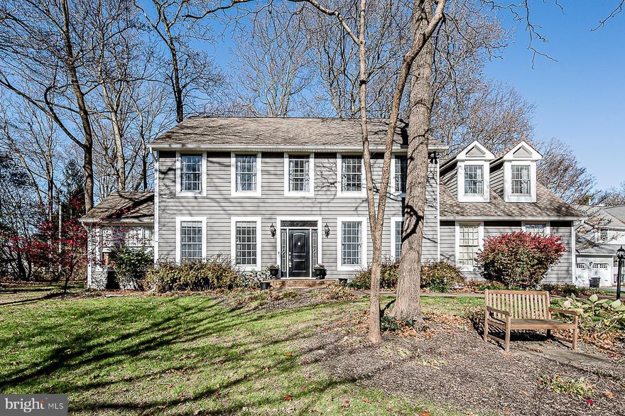 Beautifully upgraded home is great for entertaining! Gleaming hardwoods flow through the open & airy main level. Gourmet kitchen boasts center island breakfast bar with gas cooktop, gorgeous granite counters, double oven, tons of cabinet space, and Butlers pantry with walk-in food pantry. Breakfast area opens to an expansive Great Room highlighted by cathedral ceiling, palladian windows and wood burning fireplace. Step out to the wonderful back porch and brick patio, perfect for outdoor entertaining or relaxing on the porch swing overlooking the treed back yard. The main level continues with a separate formal dining room and living room, powder room, and large mud room with washer/dryer hook-up. Working from home? You'll love the convenient office with built-in shelving & cabinets! Relax in your owner's suite retreat, offering two walk-in closets with built-in organizers. Luxurious remodeled private bath boasts wood-look tile flooring, dual vessel sinks, charming claw foot tub and frameless glass shower. Four additional large bedrooms, and 2020 remodeled hall bath with dual vanities and huge shower, complete the upper level. The lower level includes a huge rec room with conveying flat screen TV, a separate play room, and 3rd full bath. You'll love the unique "cool room"/wine cellar!  An ample-sized laundry room with front-load washer &  dryer, and storage room with walk-up to yard, complete this level.  So many updates & upgrades!.. Recent roof, 2-zoned heating & cooling, front & garage doors, replaced water main, chimney crown & liner, and refrigerator. Exquisitely remodeled full baths. Custom crown moldings, shadow boxing, recessed lights. Great location...Minutes to both Ellicott City and Columbia restaurants & amenities. Easy access to Routes 40, 29, 100 and I-70 & 695. Offer Today!