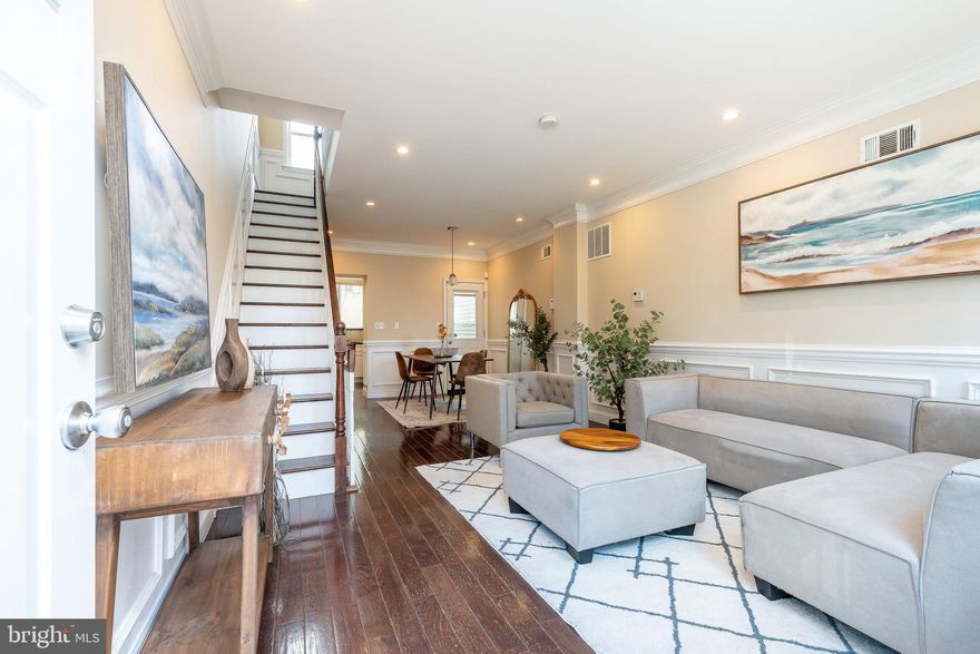 Step into a beautifully renovated Fairmount rowhome that brings together timeless Philly charm and a fresh, modern vibe sitting on a treeline street across from the park! Inside, you’ll find an open, sun-filled main level with rich dark hardwoods, crisp white wainscoting trim, and warm neutral tones that create a clean, elevated feel. The living and dining areas flow seamlessly into a sleek, updated kitchen featuring white shaker cabinetry, stainless appliances, dark countertops, and a textured glass mosaic backsplash. Upstairs, three bright bedrooms continue the high-end look with hardwood floors and thoughtful design touches—plus a standout primary suite with a spa-like bathroom complete with a jetted soaking tub, separate glass shower, and double vanity. The finished lower level adds even more flexibility with a recreation area, laundry space, and convenient half bath. And when you want a little fresh air? A private brick courtyard gives you the perfect spot to unwind.

All of this sits in one of Fairmount’s most walkable pockets—steps from a sprawling park and recreation center, minutes from Center City, and surrounded by everyday essentials and local favorites. Within a 10-minute radius, you’ll find Whole Foods, Bar Hygge, Rybrew, Vineyards Cafe, Warehouse Cafe Philly, Urban Saloon, Jack’s Firehouse, Fairmount Avenue restaurants, boutique gyms, coffee shops, museums, and easy access to major highways and public transit like the Broad street line going from Temple down to the Sports Stadiums. It’s the ideal blend of neighborhood comfort and city convenience… all wrapped into one move-in-ready home.