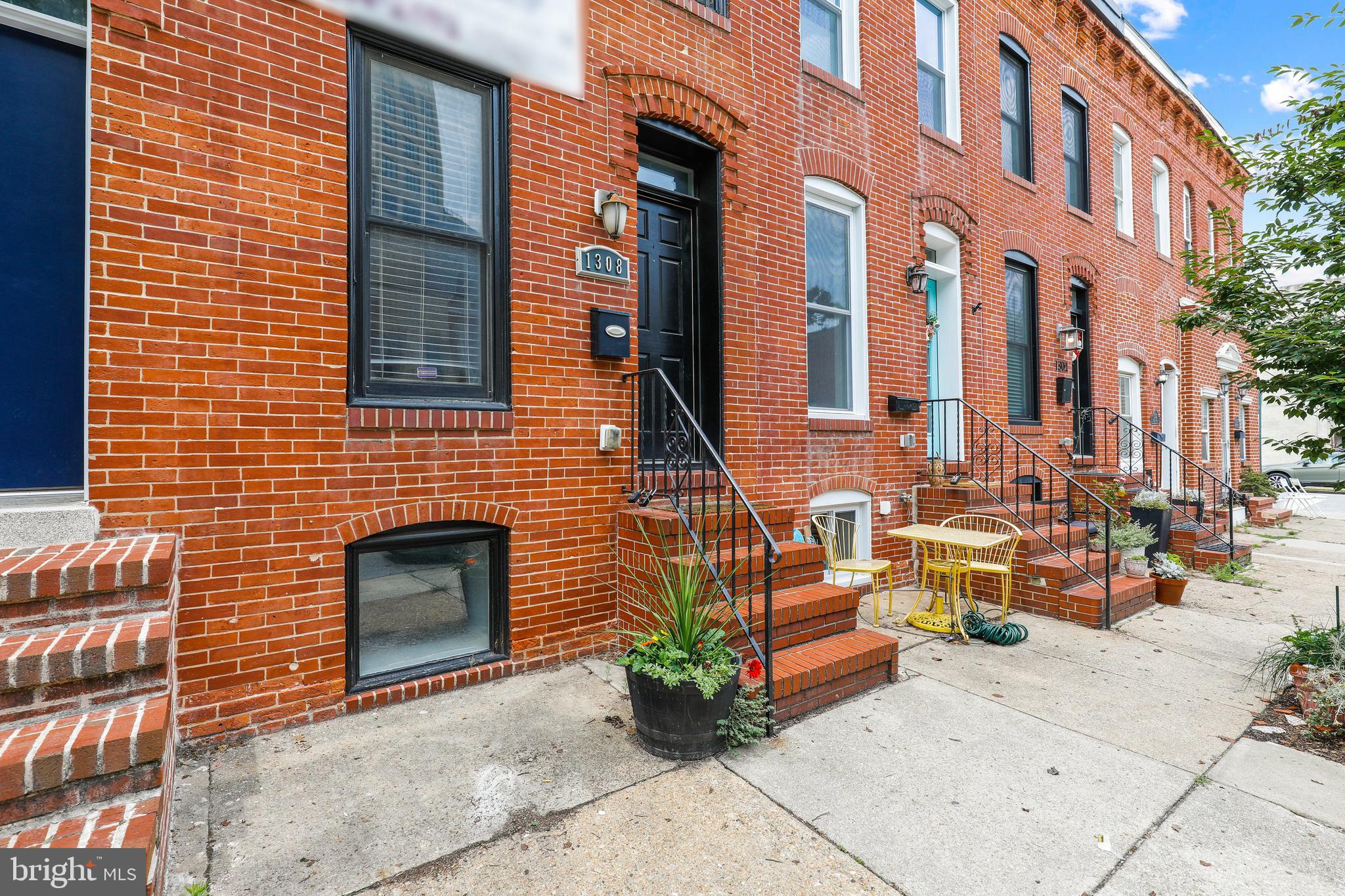 A+ Locust Point location with PARKING, CHAP, & Rooftop deck! This one has it all - 3 bedroom 3.5 bathroom historic renovation with 2 years left on the CHAP tax credit with large easy access parking pad, finished basement, and rooftop deck. Totally gutted down to the brick walls in 2013 with all new EVERYTHING! The first floor is wide open with exposed brick in the family room, coat closet and powder room on the main level, large kitchen granite, SS appliances, breakfast bar and rear dining room that leads out to the rear parking pad. The basement is finished with an additional bedroom with its own full bath. The upper level includes 2 large bedrooms, a hall bathroom, and the owners suite in the rear with ample closet space and attached full bathroom. The upper hallway includes a full sized washer and dryer with access to the rooftop deck. This home was built new by Van Allen Homes & has been meticulously maintained. This highly rentable set up is a great investment on one of the best blocks in Locust Point!