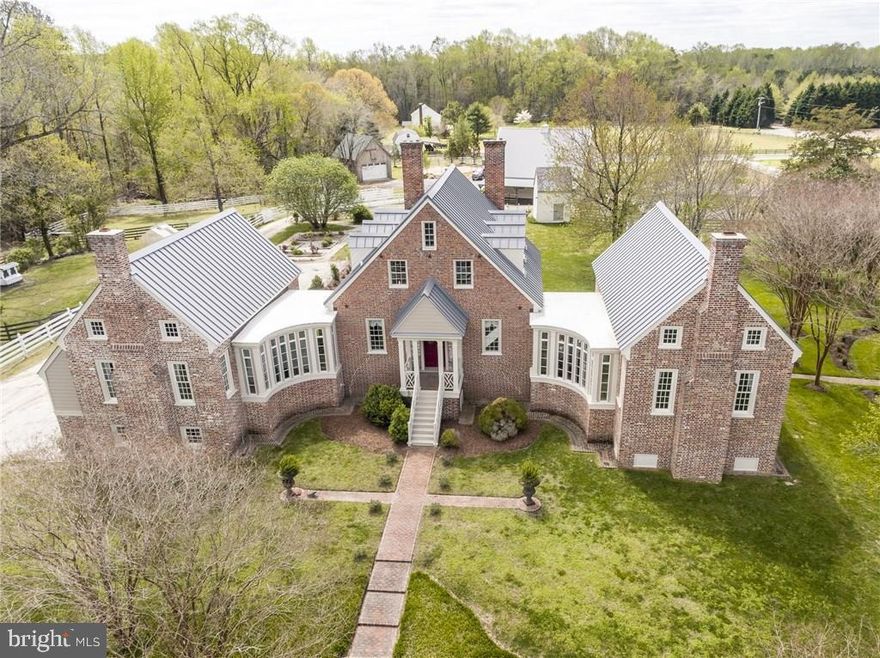 NEW to the Market!! LOOKING for a RENOVATED c. 1809 historical Equestrian Estate in Smithfield? This bucolic farm boasts top notch amenities whilst in keeping with all of the integrity expected of a historical home. The “Day-Casey” house offers  6851 total sq ft (includes the finished basement ) 5 bed, 3.5 bath, chefs kitchen w/ top of the line appliances, formal dining room, great room, living room, original hardwood floors/brick/crown moulding throughout, flemish brick chimneys, french doors, beamed ceilings, tin roof, 8 fireplaces, sitting porches, main home wing additions (2014), Geothermal, first floor Primary suite w/cathedral-style pine ceilings w/a parking garage nestled below, finished Walkout English basement is perfect for in-laws or guests. The Farm offers  22.62 acres, 4 stall center aisle main barn, 4 board fencing, private pond, Center aisle Horse barn, tack room, hot/cold washrack, 2 stall stallion/pony barn, paddocks, 80x200 riding arena with footing & Private Pagan river frontage & dock on property. Fabulous location  Waterfront community, Fine dining, shops, museums (Smithfield), local winery/brewery, major hospitals, Norfolk/beaches 30 min, RVA 1hr, & airports.