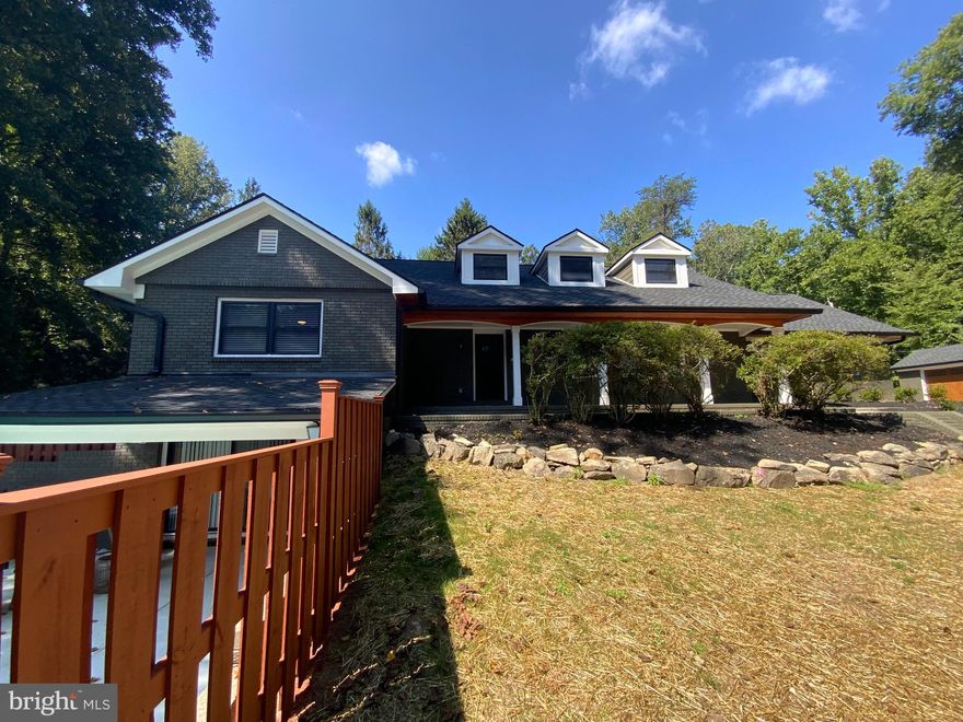 PRICE IMPROVED!!!!! Welcome to this contemporary modem residence located in Windsor Mill. This light-filled residence is set on a picturesque hillside, backing up to mature woods with wonderful views and complete privacy. Close to The Woodlands Golf Course, King Memorial Park, Patapsco River. Easily connected to I-695. Many quality eat-outs and convenience stores are nearby. The 4,615 square foot home offers 5 bedrooms and 4.5 bathrooms, Studio spanning three floors. This one-of-a-kind home features a fabulous floor plan with a two-car garage and plenty of upgrades: New asphalt- driveways, and parking. Pool resurfaces, new concrete, pump, filters, plumbing, capping, repair, and plastering. Build a new shed for pool house equipment. Porch, build in the privacy fence. New deck. Exterior porch roof – 36’x26’ build-out framing. Ceiling closing with pinewood. Install cedar wood around. 2 ceiling fans, and LED lights. Build a wood fireplace with natural stone. Install stone around columns. New stamped concrete. Front and back of the house- new stamped concrete sidewalks and flax stone. Back of house-build deck with TREX and PVC. Decorative metal handrails, with cedar wood pergola. Replace the roof throughout the house. (GAF timberline shingles)Install new siding (James Hardie) cedar wood shake decorative throughout the house. Hardie Board trims, cedar soffit throughout. New gutters, and downspouts throughout the house. New windows, new front doors (5-doors), sliding doors (3) .2- Electric heat pump (4 tons and 2 tons) (TRANE) with ducts. Open concept floor plan- kitchen new white cabinets (white shaker) new Frigidaire appliances, new CalacattaLaza Quartz. Completed bathrooms (5) one half bathroom-install new ceramic tile walls and floors. New plumbing, 2 new bathtubs, showers, vanity, toilets, exhaust fans, and new accessories. New custom frameless glass shower. Basement-new bar with cabinets (expresso)refrigerator and CalacattaLaza Quartz, New Electric throughout the house-2 main panel with breakers, new LED throughout the house. Pending light, ceiling fan, outlets, switches, GFI, USB, smoke detectors, 12 exterior floods LED lights. 6-rings Flood lights, doorbell. New Plumbing-throughout the house, new water heater, (50-gallons) sump pump, exterior valves, and drains. New doors, baseboard, trim, hard harder (bronze) New engineered hardwood floor throughout the house. Basement- life-proof plank floor and ceramic tile on the floor. New wood blinds throughout the house. Basement one room glass panels, Steam room-(4-people) with ceramic tile,  new electric fireplace, Washer and Dryer with own cabinets for storage. paint the house throughout, clean up, and landscape. drywall and Energy insulation throughout the house. This is a great home for entertaining, working from home, or spending family time together. Visitors are welcomed through a designated entry foyer. Wow, Don’t miss the opportunity to own this home!!