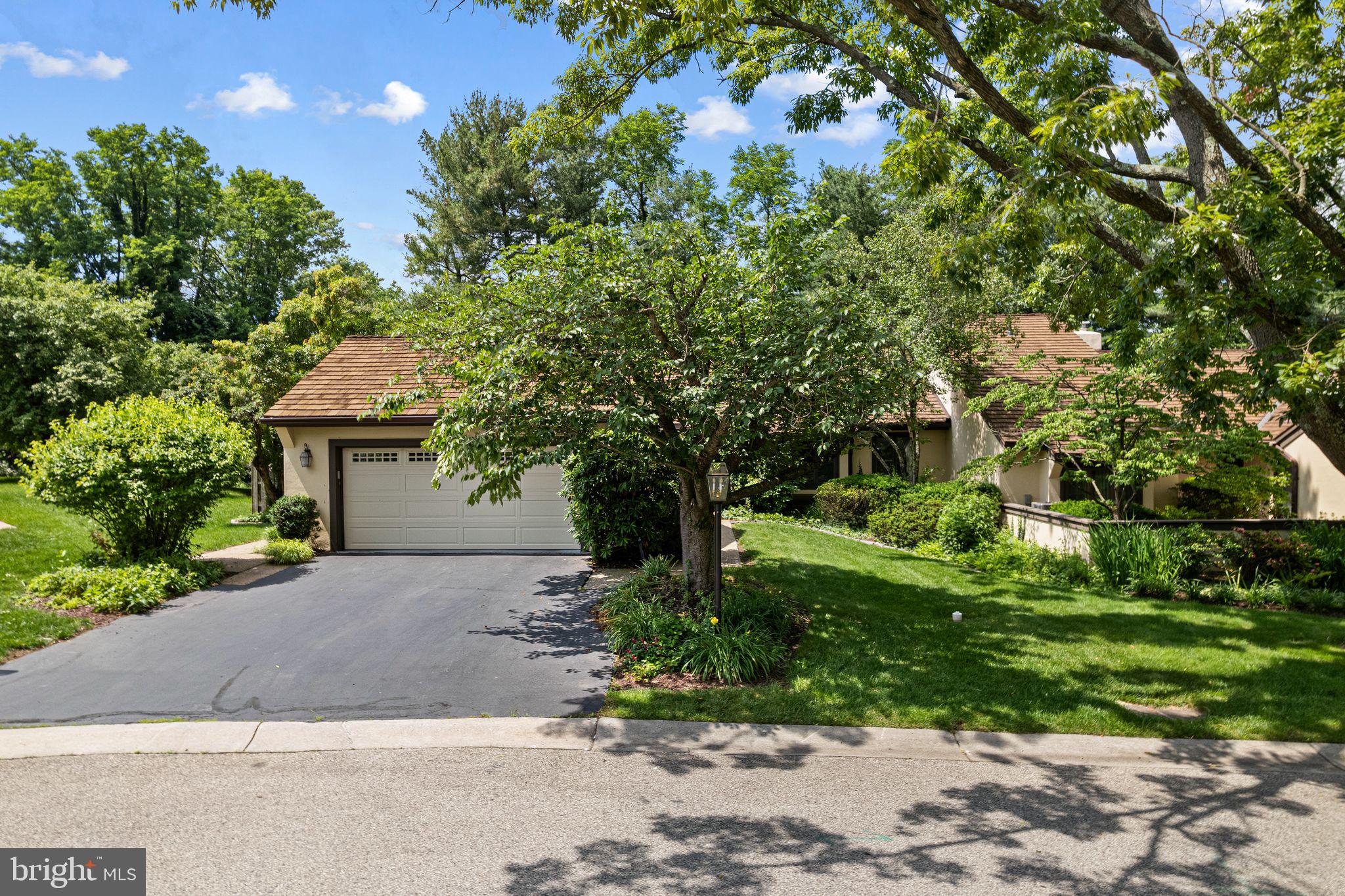 Welcome to 6 Steeplechase Lane, a beautifully maintained 3 bedroom 2 bath home featuring a 2 car garage nestled within the prestigious Whitpain Farm gated community—120 acres of lush, landscaped grounds located in the heart of Blue Bell.
Enjoy the ease and peace of mind that comes with living in this sought-after 55+ community, where outdoor maintenance and snow removal are taken care of for you. Simply move in and start enjoying the wonderful amenities, including a sparkling outdoor pool, two tennis courts, a community garden, and the stately Manor House—perfect for hosting gatherings, parties, and game nights. This expanded Narcissa Model offers over 2,300 square feet of bright and spacious living, including a delightful sunroom that opens to a large private patio with serene views of the beautifully manicured grounds. Inside, the elegant living room features gleaming hardwood floors and a cozy gas fireplace, seamlessly flowing into the formal dining room with a lovely bay window. The adjacent kitchen is a chef’s delight, boasting upgraded Wood-Mode cabinetry, granite countertops, stainless steel appliances including a newer JennAir dishwasher, Sub-Zero refrigerator, stylish backsplash, and updated flooring—plus a charming breakfast area.
The sunroom provides the perfect spot to relax or entertain, surrounded by natural light and views of the lush landscape. Retreat to the luxurious primary suite, complete with a window seat, walk-in closet, additional storage, a jetted soaking tub, a spacious shower, oversized vanity, and a private dressing area. Two additional well-sized bedrooms and a beautifully updated hall bath offer comfort and style for guests and family alike. Additional highlights include a main-level laundry room with access to the two-car garage, a finished portion of the basement ideal for extra living space, and ample storage throughout.
Ideally located near top-rated Blue Bell restaurants, Wentz Run Park, and major highways, this exceptional home offers the perfect combination of luxury, comfort, and convenience.
Come tour this lovely home today and discover the relaxed lifestyle that awaits you at Whitpain Farm.