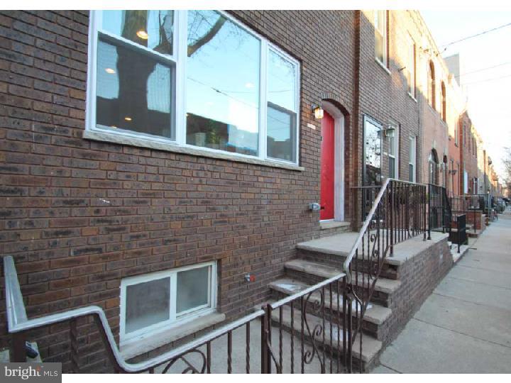 This spacious and beautiful home is located on a tree lined street in Passyunk Square. It is newly renovated, tastefully designed and has it all. The first floor is an open floor plan with large living room, powder room, dining area and kitchen. The large, modern kitchen has ample high end cabinet space, granite countertops, and glass tile backsplash. The dining area has french doors which lead to a cozy yard. The high ceilings on the first floor make this home feel exceptionally large. The second floor offers 3 bedrooms with closets, a full bathroom and a modern, private master bathroom. This home has Central Heating and Air, Hardwood floors, Recessed Lighting and even a finished basement. Walk to Broad St. Line subway and all stores, dining, and trendy coffee shops that Passyunk Square has to offer. This is a must see. You will feel at home the minute you walk in the door.