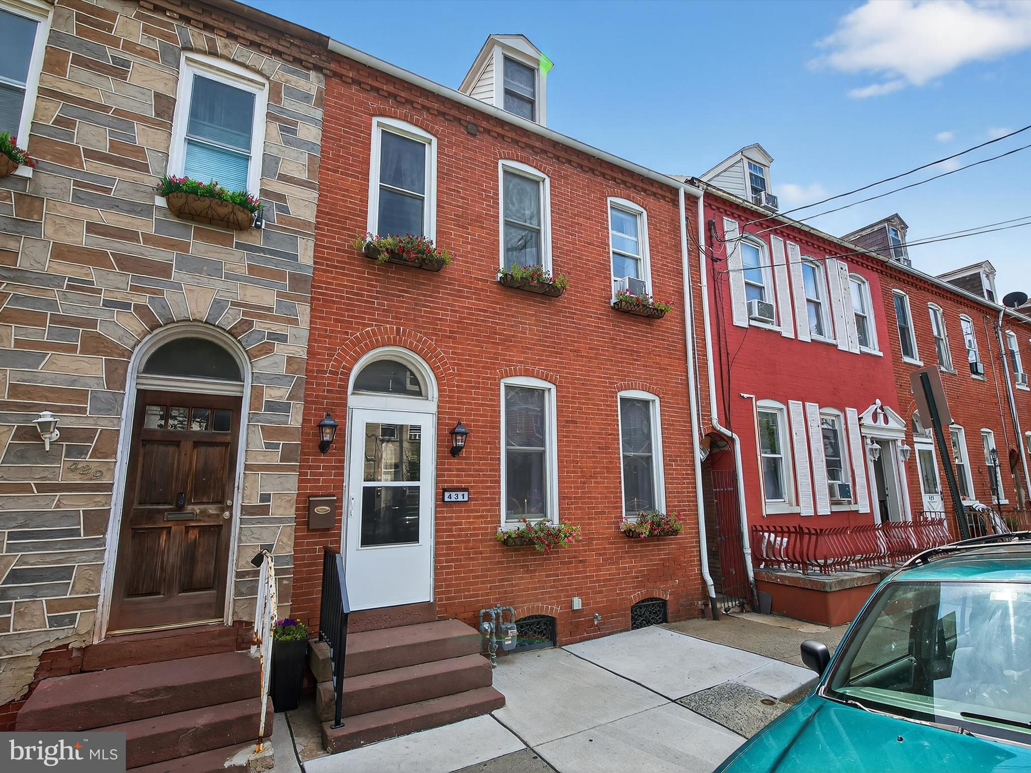 Welcome to 431 S Queen Street, Lancaster!
This fully renovated city gem offers three beautifully finished levels of living space just blocks from downtown. Walk to Southern Market, the Convention Center, and Lancaster Central Park—or simply enjoy the serene view of the historic church right across the street.
Inside, the home showcases a blend of historic charm and modern upgrades: sealed exposed brick, custom tray ceilings, crown molding, refaced cabinetry, and upgraded lighting throughout. The first floor flows seamlessly from a cozy living room with fireplace and recessed lighting, through a sunlit dining room, and into a gourmet kitchen with touch-activated appliances, a built-in pantry, and huge windows that pour in natural light.
The second floor features three bedrooms, including an expanded primary suite that feels like its own studio apartment—complete with a sitting area, fireplace, and access to a large, L-shaped private balcony with ceiling fans and space for outdoor lounging. A full bath with natural-look tile and a finished third floor with walk-in closet offer even more flexibility—perfect for a guest room, office, or studio.
The fenced backyard is a private oasis with a newly installed patio, fresh concrete sidewalk, manicured lawn, customizable exterior lighting, and tiered perennial garden beds. A versatile bonus room off the yard can serve as a hobby space, small office, or garden shed.
Additional upgrades include:
• New Roof and six new windows
• Three new screen doors
• New front and rear doors
• Fresh capping on all windows and siding on dormers
• New sidewalk and front entry
• Original stained glass transom
• Window flower boxes for added curb appeal
Please enjoy the floorplans at the end of the photos. Showings begin Friday 7/25—schedule yours today!