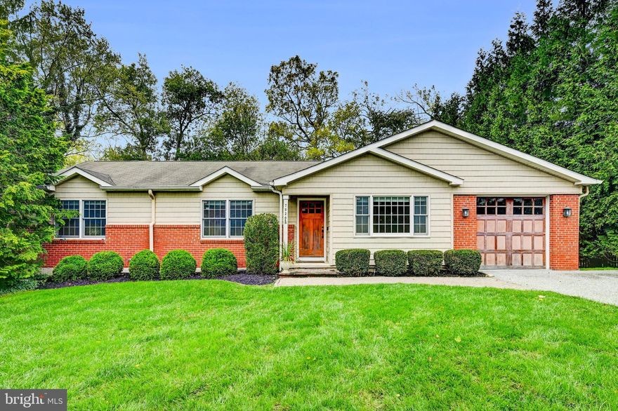 Tucked away on a beautifully landscaped .42-acre lot in sought-after Ruxton, this unassumingly spacious 5-bedroom, 3 full and 2 half bath rancher offers charm, flexibility, and functionality in a serene creekside setting. The heart of the home is a chef’s kitchen featuring granite countertops, under-cabinet lighting, a beverage refrigerator, and a huge walk-in pantry, all flowing seamlessly into open living and dining areas anchored by a classic stone fireplace. A bright four-season sunroom opens to an expansive deck overlooking the gently flowing creek—perfect for outdoor dining or quiet relaxation. The main-level primary suite features a walk-in closet and a luxurious en-suite bath with a soaking tub and walk-in shower. The finished walk-out lower level adds incredible versatility with two additional bedrooms—ideal for home offices, guest rooms, or creative spaces—plus a full bath, a second laundry area, and a separate entrance, making it perfect for multi-generational living, visiting college kids, or rental potential. Additional features include hardwood floors, a 1-car garage, a private patio, mature privacy landscaping, and thoughtful updates throughout. This unique Ruxton rancher is the perfect blend of style, space, and setting—ready to welcome you home.