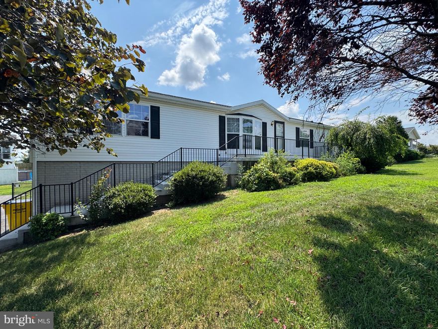 This spacious ranch-style manufactured home is located in the sought-after Summer Hill subdivision and is available and ready for immediate move-in. The home features 4 sized bedrooms, a large living room, and a comfortable family room highlighted by a corner gas fireplace. The kitchen offers ample cabinet space and a functional layout ideal for everyday living along with a skylight. Outdoor living is enhanced by a large deck overlooking a fully fenced backyard. The expansive basement includes a finished full bathroom and provides excellent potential for additional living space or recreational use. An oversized side loading two-car garage completes the property, offering abundant storage and workspace.