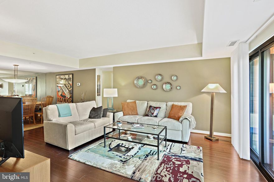 Beautifully updated condo from top to bottom!  This immaculate 2-bedroom, 2-bathroom condo in downtown Columbia is a true gem. Completely remodeled in 2016, it boasts a modern aesthetic with new kitchen and bathrooms,  hardwood floors, new light fixtures, window treatments and fresh paint throughout. The upgraded windows flood the living space with natural light, and the building offers top-notch amenities, including a doorman for added security, an outdoor pool, a fitness room, and the convenience of a covered parking space. Additionally, this condo provides extra storage with two spacious units.