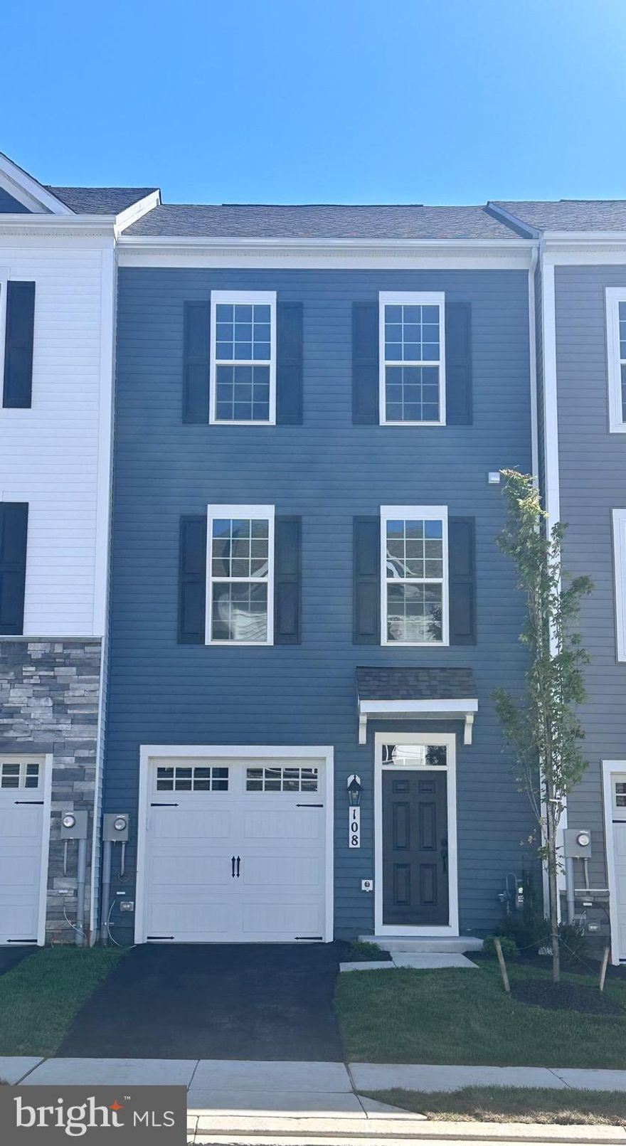 The Auburn II luxury townhome in Spring Bank offers elegant, low-maintenance living with three fully finished levels, four spacious bedrooms, three and a half baths, and a one-car garage. Ideally situated within walking distance to Clemson Corner and Market Square, this home combines comfort, convenience, and style. The interior showcases high-end designer finishes, including a chef-inspired kitchen with quartz countertops, stainless steel appliances, subway tile backsplash, and a large center island that opens to a bright sunroom extension. Upstairs, the owner’s suite features a vaulted ceiling, walk-in closet, and a spa-like bath with an oversized shower wrapped in floor-to-ceiling tile. Enjoy outdoor living on the 12’ x 18’ composite deck, perfect for relaxing or entertaining guests.