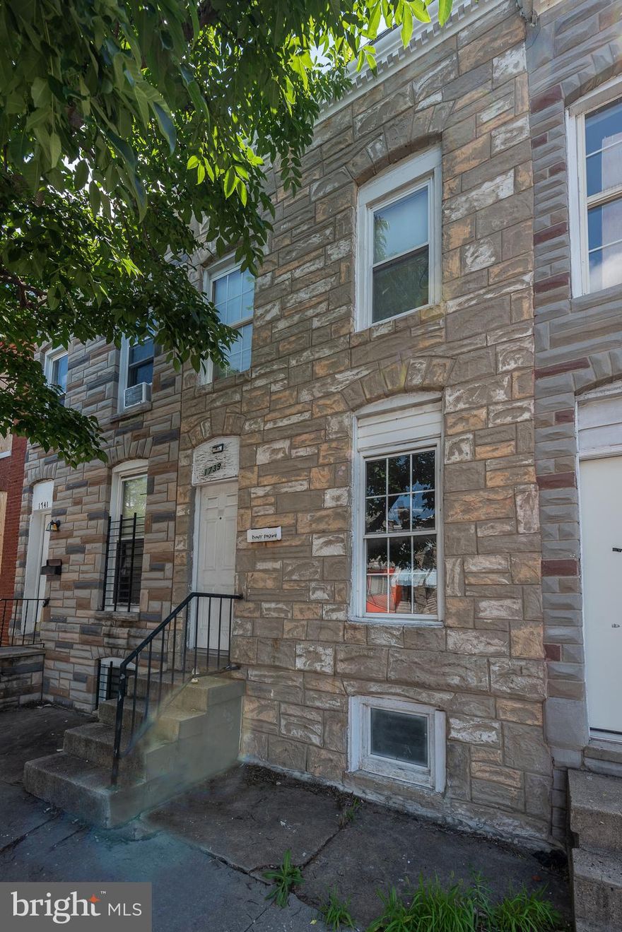 RENOVATION OPPORTUNITY!  Spacious rowhome in need of total renovation. 3 bedroom 1 bath rowhome with a living room, dining room, kitchen, unfinished basement, and a rear yard.  Sold As-Is!