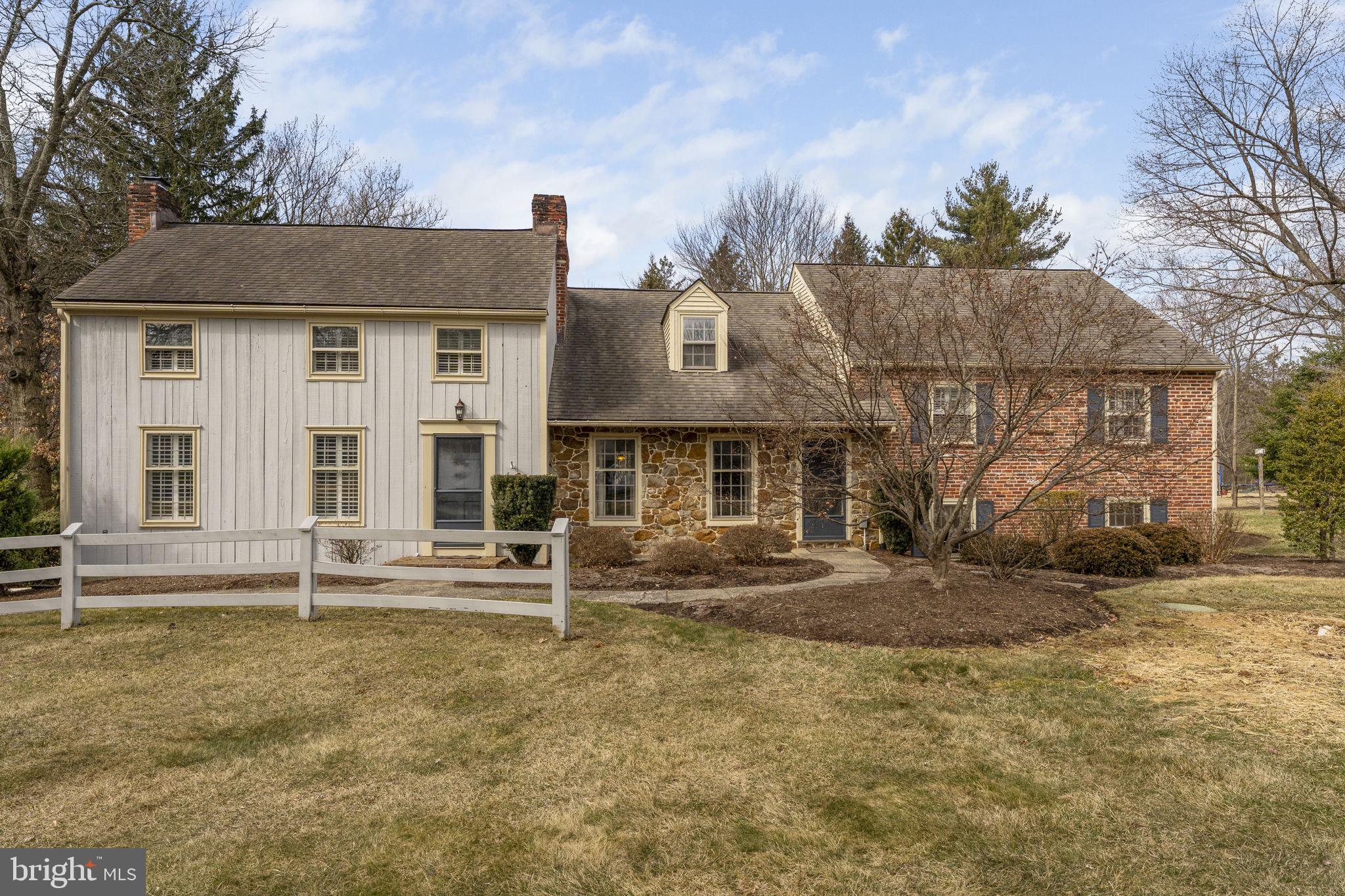 Welcome to 8 Stonehenge Lane! This 5-bedroom, 2 full bathrooms, and 3 half bathrooms brick and stone front home with an expanded wood sided addition is the epitome of elegance and comfort and showcases the country charm of Chester County. Nestled on 1.1 acres in desirable Stonehenge, this well-maintained property offers privacy and tranquility while being just minutes from downtown Malvern. Enter the main level and notice the hardwood floors extending into the formal dining room with a lovely wood burning fireplace with brick surround and continuing into the formal living room with a second wood burning fireplace. At the back of the house, overlooking the lovely backyard, is the eat-in kitchen with charming brick floors, granite countertops, stainless appliances, a farmhouse sink and breakfast bar with seating. Adjacent to the eating area is a butlers pantry equipped with a bar and beverage refrigerator and access to a half bathroom. The sunroom with low maintenance tile floors and a sliding glass door to the composite deck and backyard completes the main level. The deck is large enough to host summer parties with room for serving burgers and enjoying your guest’s company. It also includes a unique high-top table made from a tree that was growing through the deck. On the first upper level, you will find two bright, sunny bedrooms with access to the full hall bathroom with a large single vanity and tub/shower combination. The third bedroom on this level boasts a private half bathroom. Up to the upper level is a fourth bedroom with built-in shelving, skylights for plenty of natural light and two closets. This room provides access to a large unfinished attic that’s perfect for storage. You can continue through the fourth bedroom and across the landing to the master bedroom. You can also close off the master bedroom from the rest of the upper floor for ultimate privacy as you have your own staircase leading down to the living room. The master bedroom has hardwood floors, walk-in closet and a dressing area leading into the en suite bathroom. The bathroom offers a double vanity and a step-in shower with tile surround, river stone floor and frameless glass enclosure. The master bedroom also has access to another unfinished attic space. Don’t miss the lower-level den! It has hardwood floors and ample closet space for storage. You’ll also find the laundry, a half bathroom and the private home office providing the perfect space for work or study. The two-car garage with room for storage is accessible from the lower level as well. Across the backyard, you’ll find a shed with electric that would be perfect for a three season remote space for an office, yoga room or art studio. The home is also equipped with smart home features including an ADT alarm system, Ring cameras, smart locks and smart appliances. While you enjoy quiet Stonehenge, a neighborhood great for walking, you’re still just minutes from Malvern Borough’s shops, restaurants and public transportation including the Paoli/Thorndale Septa line. You also have easy access to Rte 202 and the PA Turnpike plus numerous parks and the Chester Valley Trail. Don’t miss this one!