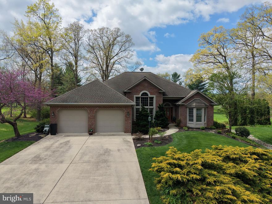 LOVELY RANCH-STYLE HOME IN PENN NATIONAL! This spacious and well-appointed home offers 4 bedrooms and 3 full bathrooms, featuring high ceilings and an open feel throughout. The main level includes 3 bedrooms, highlighted by a generous primary suite with two walk-in closets, a private en-suite bath, and a hot tub just off the bath for added relaxation. You’ll also find a welcoming family room with a stunning stone fireplace, a kitchen, dining room, dedicated office, and a bright, spacious sunroom. A convenient main-level laundry area is tucked within the pantry for easy access. The full basement expands your living space with a finished area that includes a living room, kitchen/bar area, dining space, a large bedroom, and an exercise room that could serve as an additional bedroom. The unfinished portion offers ample storage space. Outside, enjoy an attached 2-car garage, concrete driveway, and a beautiful setting that backs directly to Penn National Golf Course. Ideally located just minutes from Route 30, and I-81, as well as shopping, dining, and more, this home offers both convenience and lifestyle. Don’t miss the opportunity to make this exceptional property your own!