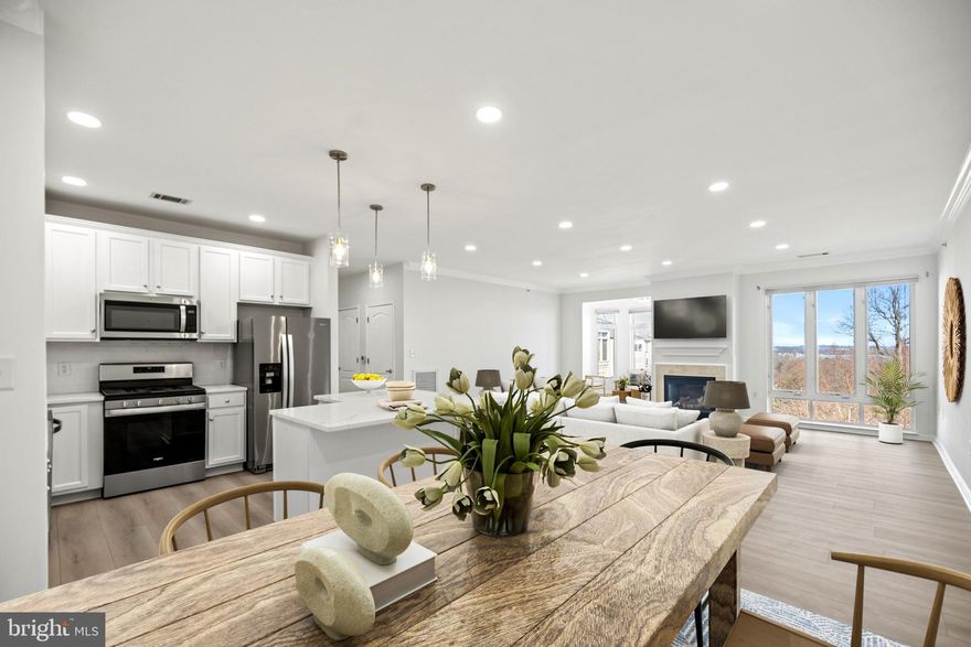 Welcome to your dream penthouse! This beautiful, completely renovated 2 BR / 2BA condo offers an unparalleled living experience. Inside you’ll find a bright and inviting open floor plan, perfect for entertaining and connection, featuring tall windows with AMAZING views of the Potomac River, and new floors throughout. The gourmet kitchen features stainless steel appliances with a gas range, white cabinets, a kitchen island with storage, and quartz countertops! The living room is just off the kitchen and features a gas fireplace and crown molding. The adjacent sunroom provides 2 walls of windows and tree top and water views! The primary bedroom is an owner’s retreat, featuring a spa-like en-suite bathroom, complete with a shower stall with glass door, double vanities, and a linen closet. Completing this dreamy bedroom is a balcony and 2 closets, one of which is a large walk-in. The secondary bedroom is of good size and features ample closet space. The home offers plenty of storage space: a large entry closet, an extra wide hall closet with shelving, plus a separate storage closet just moments from the unit (on the same floor), perfect for housing your seasonal items! The home also includes a second full BA, and a full-size, side-by-side washer and dryer. Recent upgrades include a new HVAC system (2024), renovated bathrooms (2024), new core luxury vinyl plan flooring with cork pad (2024), new paint, new quartz countertops and backsplash, and newer stainless-steel appliances (2022). There is so much to love, including the community! Potomac Pointe is an amenity-rich, luxury gated-community offering walking / jogging paths with scenic views and a clubhouse that features a pool, gym, business center, community room, and billiard’s room. Completing this amazing community is a playground, EV charging station, secure-entry and elevatored buildings! Parking is a breeze with 1 assigned parking and 1 guest parking space or take a quick 7-minute stroll to the VRE train station for seamless access to various transportation options. Ideally located just minutes to Historic Occoquan (boutique shops and restaurants), the Stonebridge Potomac Town Center (Wegmans, Apple Store and premium restaurants) and Potomac Mills Mall (200+ stores and factory outlets), and nearby to I-95 for access to Quantico and the Pentagon, and proximity to Fort Belvoir, too! Style, Location and Convenience - you CAN have it all! Welcome Home!