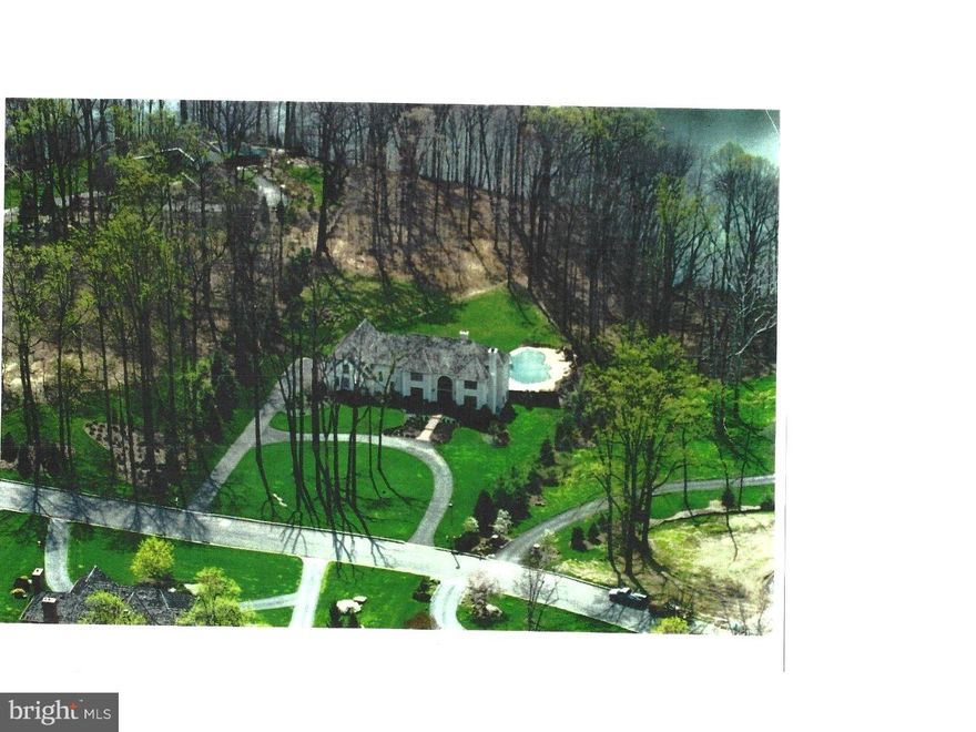 A STUNNING VIEW OF SPRINGTON RESERVOIR!  Situated in Springton Pointe, a most premium & desired location. Distinctive craftsmanship & unparalled quality abounds in this truly one of a kind home. Enter double solid mahogany hand carved doors with etched and molded glass panels.  Formal, two story foyer has a Carrara marble floor and crystal chandelier.  Quality details fill every room, for example:  Dark cherry floor to ceiling built-ins in the library, SieMatic kitchen cabinets from Germany, Miele dishwasher, Thermador 5 burner gas range, butler's pantry, homemaker's room/laundry room, back staircase, built-in cherry entertainment center for stereo, TV, refrigerator, bar with brass sink, two staircases to lower level, two first floor powder rooms, one with a Schonbek crystal chandelier and Medici's Gold Swan by Raphael faucet. Two built-in China closets with dome bonnets and lights in the gorgeous dining room, four fireplaces, a second floor 30' long au pair suite has 10' high ceilings, intercom, speakers and cable hookup thruout the home, central vac system, walk in cedar closet, Lower level 12' long wet bar with refrigerator and dishwasher, parquet dance floor.  The large pool has honed granite steps with a waterfall and was replastered in 2014.  The rear yard is totally fenced in, a circular driveway leads to the three car garage.  A secluded setting, yet so close to schools, shopping, and 20 minutes from the Phila. airport.  See this home today, you won't be disappointed.